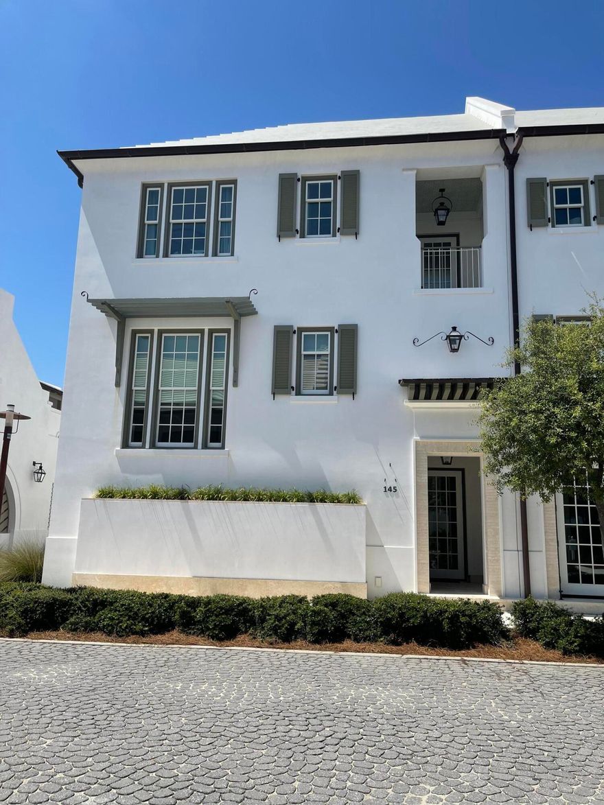 ALYS BEACH stunner! Come see and experience the beauty of this lovely corner home located in ''Claremont Courts'' residence by Renowned Khoury-Vogt Architects. Without question, this luxury modern courtyard home features 16 foot ceilings with tall windows everywhere! This home sits on a corner  lot which allows for an entire wall of windows letting in beautiful light throughout this home. Main floor with open floor plan which opens to the al fresco dining and lounging areas with gas fireplace. Back inside, the gourmet kitchen is slightly tucked away from the dining area, perfect set up for your favorite private chef dinners and large party gatherings. Primary bedroom conveniently located on the FIRST floor, 2 more bedrooms and bathrooms located upstairs. Please see the MORE tab! Your large courtyard takes you up a small flight of steps located above your oversized two car garage, to your private studio style Carriage House Casita with a summer kitchen, writing desk, and oversized beautifully appointed bathroom with a luxurious marble counter along with marble tiles in the shower. Carriage House enjoys an oversized balcony with two separate sitting areas plus an outside TV for watching all your game day plays. Don't miss seeing the beautifully adorned Venetian plaster interior walls as well.  Architectural features make this home a one of a kind amongst all the amazing homes in this exceptionally unique, breathtaking community.  The unbelievable private beachfront club is yours to enjoy as an Owner in this exclusive beach community of ALYS BEACH. Don't miss out on this one!
