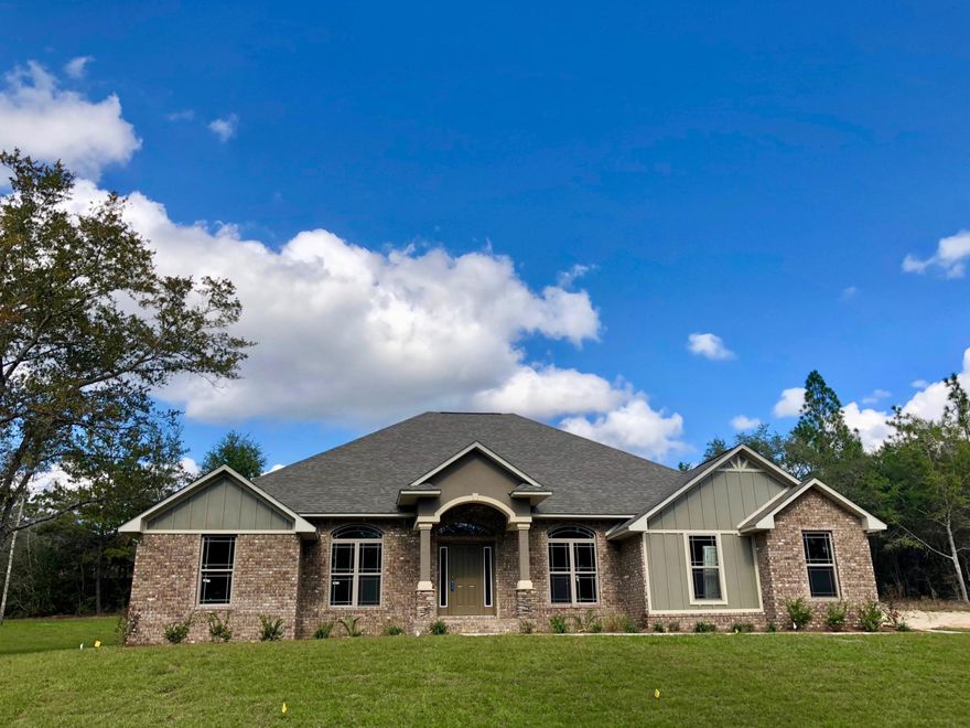 Ready Now! New for Fox Valley, we've combined two home-sites for maximum acreage, with a side-entry garage for more conveniency! Enjoy a spacious 3,011sq.ft. plan on nearly a half-acre, in South-west Crestview. This beautiful home favors larger bedroom sizes with a split layout, and it features an expansive Great Room. A wide Florida Room overlooks the back patio and offers quick entry to the second full bathroom, and it can be isolated with two sets of French Doors. The kitchen features a wraparound bar with granite countertops, real maple cabinets, recessed and undermount lighting, and a large walk-in pantry.