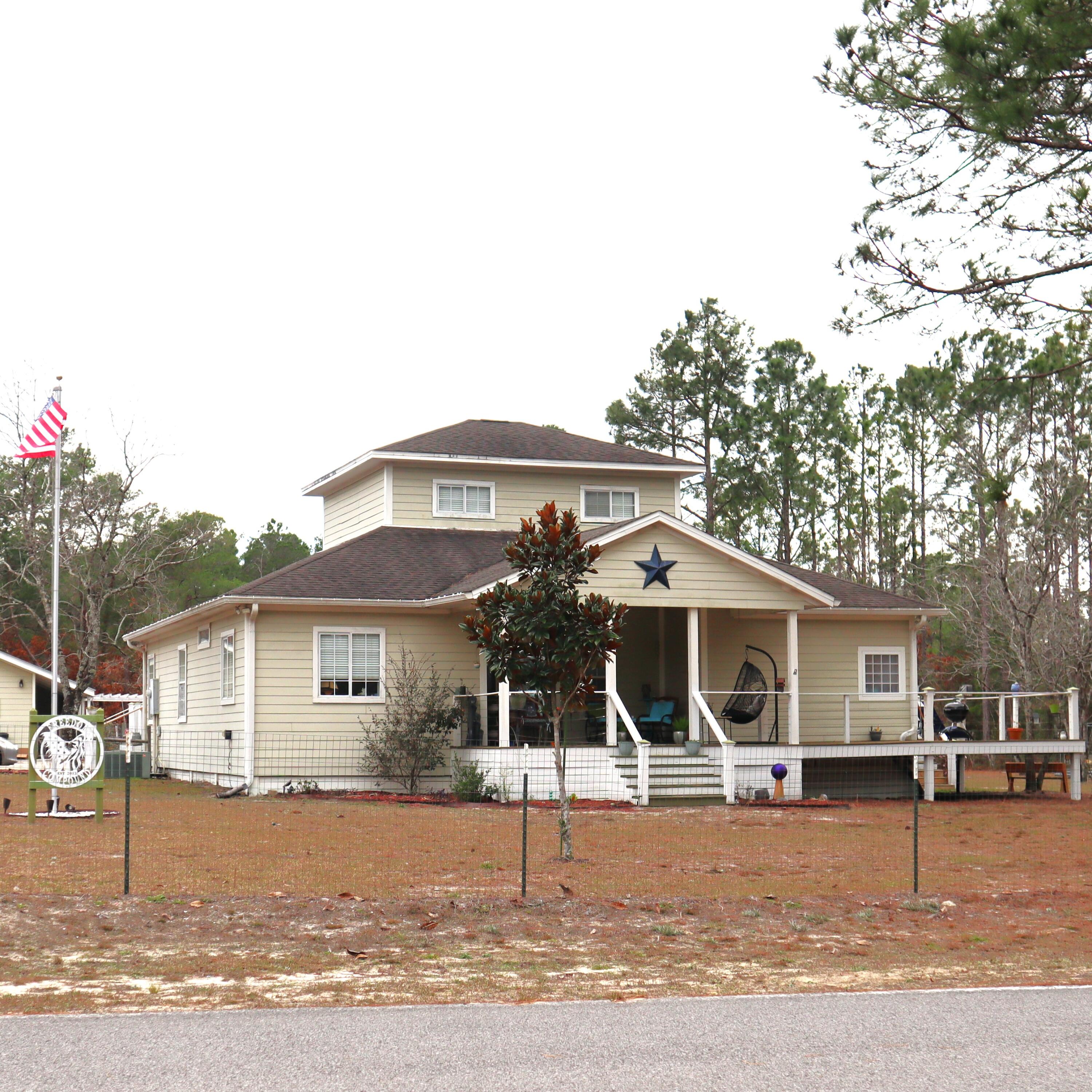 Welcome home and look at all the space! The main home has a welcoming front porch and a spacious split 4 bedroom floor plan. Kitchen is spacious with a dining room and office across from it. Living room can hold a sectional and other sitting areas. Master bedroom and bathroom have walk in closets with plenty of space. Back porch can accommodate large gatherings, and the wood has recently been replaced. There is a bonus room upstairs that would make a great office, playroom, or additional bedroom. There is a 2 bedroom 1 bath guest house with a full kitchen that can be rented or extra space for family. There is a 2 car detached garage with space for tools. This property has a chicken coop, garden area, and an area that used to be for goats with a hay barn. Horses are allowed.