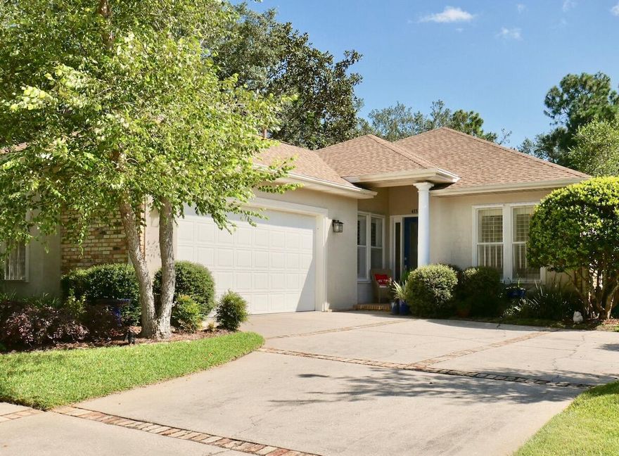 Immaculate & beautifully maintained Greg Goodwin built home with wonderful views of the Rocky Bayou golfcourse in the Fairway Woods community of Rocky Bayou. This home offers a brick contemporary exterior with stucco accents framed by a professionally landscaped yard AND is located next to common area that will never be built on! Low maintenance tile floors throughout the living areas also offer crown molding in most rooms. This home is the perfect combination of an open floorplan that also has defined traditional living spaces as well as a wonderful screened porch along the rear. The living room is accented with built in shelving and cabinetry and also has a convenient wet bar as well. The updated kitchen that is open to the living room offers lots of cabinets, quartz counters, and newer