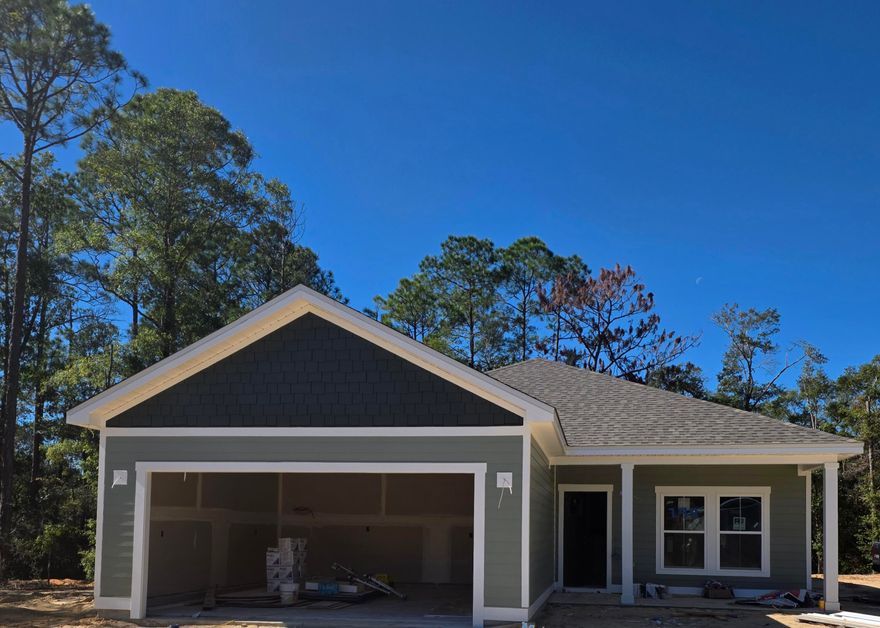 *****Taking back-up offers*****Welcome to your peaceful retreat! This spacious NEW  3-bedroom, 2-bath home offers a total 2,479 sq ft of comfortable living space and is perfectly situated on a beautifully wooded 1.23-acre parcel. Enjoy the perfect blend of privacy and nature with a covered back dock that overlooks serene woods--ideal for relaxing mornings or quiet evenings surrounded by nature. The home features an open floor plan with  generous living and dining areas, and a large kitchen perfect for entertaining or family gatherings. The spacious primary suite includes a full bath, large walk-in closet, and the two additional bedrooms offer plenty of room for guests, a home office, or growing family needs. Construction is underway, but it's not too late to customize to reflect your unique style. This property offers a unique opportunity to live in a nature setting without sacrificing space or comfort. This area is on the rise with major job growth from developments like the Amazon Distribution Facility and the Shoal River Ranch Aerospace Manufacturing Project creating opportunity and boosting local value. Enjoy country living while staying connected just a short drive to Crestview, Fort Walton Beach, Destin, and surrounding areas via Hwy 90 and nearby interstate access. Don't miss this opportunity to own a new construction home by Southern Home Solutions, in a prime, up-and-coming area. Contact us today for floor plans, estimated completion, and customization options! Don't forget to ask about special financing / owner financing available 