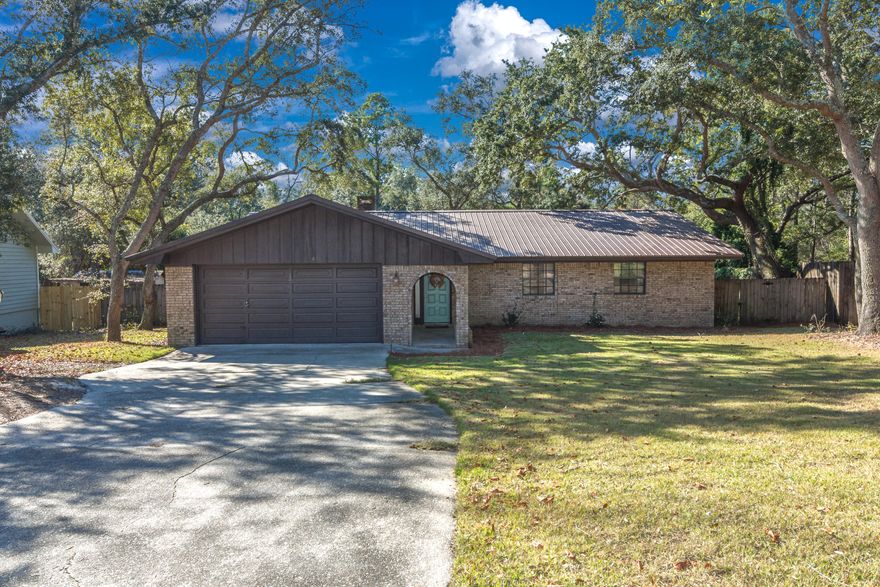 Updated 3 bedroom, 2 bathroom home in Bluewater Bay. Home has a metal roof, full brick exterior and large covered back porch overlooking a fully landscaped and fenced back yard. The home has an open feel with vaulted living room ceiling, added recessed lighting and brick wood burning fireplace. Complete kitchen remodel with cabinets featuring soft close doors and drawers and QUARTZ counters and STAINLESS appliance package. The master bath has had a complete renovation including custom marble look tile shower as well as new vanity with marble counter and undermount sink. A custom sliding barn door has been added for privacy between the bedroom and bathroom. The hall bath features a subway tile shower surround with custom storage niche. Schedule your private viewing today.