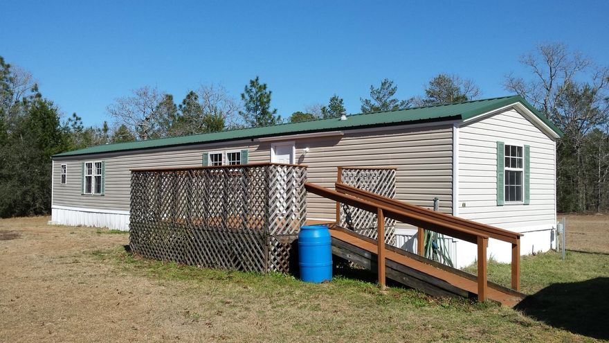 OWNER FINANCING AVAILABLE!!! Ready to move to peace & quiet? This has a Crestview address but is really located in Mossy Head, FL. This secluded acreage boasts a 2004 Mobile home with 2 beds/2 Baths that is renovated with NEW CARPET, NEW PAINT, NEW DOORS, NEW SINK, and much more. The Land is partially cleared with a deep well. Get ready to build your dream home! Parcel located next to Blackstone Golf Course, the new FedEX distribution center, and minutes to the Interstate to take you to the beautiful white sandy beaches & Emerald green waters of the Emerald Coast!