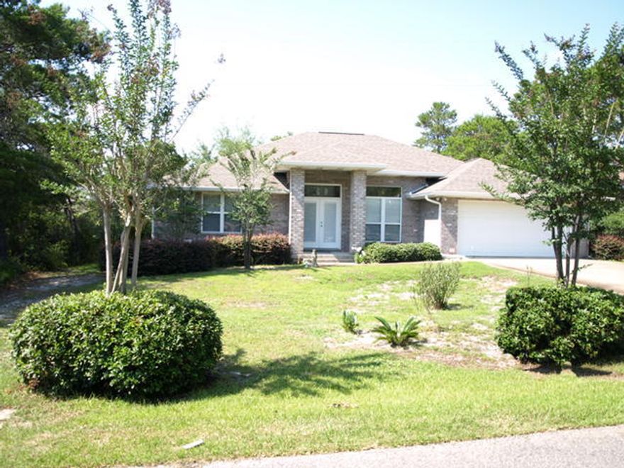 Walk to Santa Rosa Golf Club from this all-brick charmer. All on one level with 3 large bedrooms, 2 baths and a separate office, this home is a must see. It offers ceramic tile flooring throughout living areas, a separate dining room, a corner fireplace, fully equipped kitchen with granite counters and a large pantry. A spacious covered patio allows for peaceful relaxing with plenty of room to grill and enjoy the enclosed back yard. The 2-car garage can easily store your golf cart and all of your tools and toys. No HOA fees and this home is also a short bike ride or walk to the beach. Property offered AS-IS