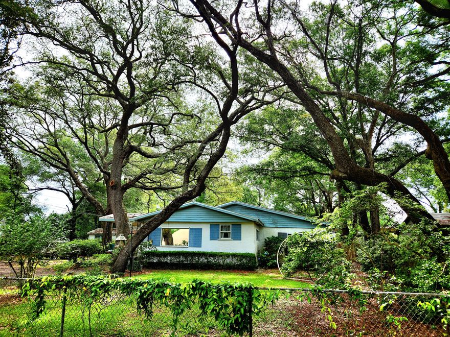 Florida Cottage in the heart of Niceville. Property can be subdivided into 3 lots according to Niceville planning and zoning. Current garage used to be a second house. This property has huge investment potential. Property has the most beautiful Oak trees,  well over 100 years old. The roof is approximately 6 years old and the electric has been updated, the exterior unit to the HVAC shows manufacture date as 2016.  There are several outbuilding besides the garage and also an underground shelter.Come check out all the possibilities this property has to offer!
