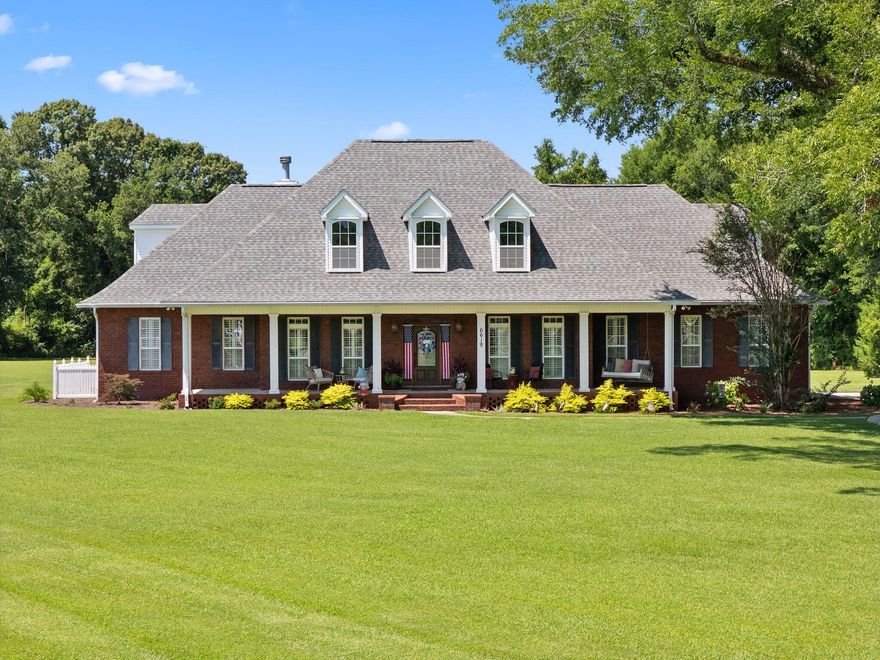 Welcome to your own private retreat! Tucked away in a secluded six-home cul-de-sac just 3.5 miles from Five Points, this stunning custom-built home offers space, privacy, and elegance on 4.24 beautifully landscaped acres, with no HOA restrictions. Step inside to discover rich hardwood and tile flooring, wide crown molding, plantation shutters, and soaring 20-ft ceilings in the main living area. The smart floor plan includes a formal dining room, a private home office or sitting room, and a spacious great room with built-in shelving and double French doors that open to your outdoor oasis.
The chef's kitchen is equally impressive, featuring custom off-white glazed cabinetry, a copper vent hood, a tile backsplash, and a large island with bar seating. There's also a casual dining space and cozy sitting area, perfect for everyday living.
The primary suite is situated on the main floor and features hardwood flooring, a spacious walk-in closet, and a spa-inspired bath with dual granite vanities. Upstairs, you'll find three additional bedrooms, two full bathrooms, and a massive rec/media room wired for surround sound.
 Enjoy lazy afternoons by the kidney-shaped saltwater pool, recently upgraded with a new liner, variable-speed pump, and updated lighting. A charming pergola set on brick pavers provides a shaded spot to relax or entertain. The 3.5-acre irrigated lawn is supported by a brand-new well pump, and an invisible fence keeps pets secure.
Additional highlights: Heated/cooled walk-in attic plus floored storage areas,
Bosch oven & microwave/convection oven (2023), Smart refrigerator & dishwasher (2022), New roof (2020), New water heater (2025), Washer and Dryer convey.  This rare property blends custom finishes, functional space, and serene privacy, with no HOA. Schedule your private showing today and fall in love with this one-of-a-kind home!