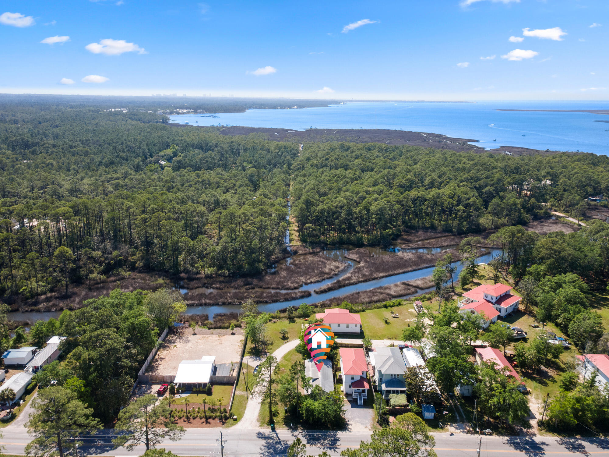No HOA! Calling all beach lovers and boat enthusiasts! Welcome to this charming coastal cottage, primely located just feet from Cessna Landing County Park and boat ramp to Choctawhatchee Bay. This location offers close proximity to sugar white sand Gulf beaches, beautiful state parks, and the best of shopping, dining and entertainment. Approximately five minutes (3 miles) to Ed Walline Regional Beach access, located directly down the street. Relax on the expansive front porch, perfect for enjoying afternoon sunsets or your morning coffee. You will love the abundance of natural light that flows through the property 15 foot ceilings. All one level, this home features a split bedroom plan that is perfect for privacy and entertaining. The master suite features a tray ceiling and a large walk in closetand ensuite. The guest bedroom also has a private access to the guest bathroom, which is located next to the spacious office featuring floor to ceiling windows overlooking lush landscape. Ready for move in, this property has been updated with brand new LVP flooring throughout, newly painted, brand new trim and vanities. Enjoy putting your final touches and making it your personal piece of paradise along the Gulf coast.
