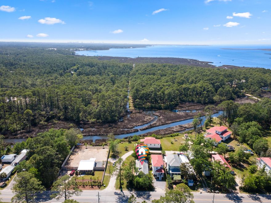 No HOA! Calling all beach lovers and boat enthusiasts! Welcome to this charming coastal cottage, primely located just feet from Cessna Landing County Park and boat ramp to Choctawhatchee Bay. This location offers close proximity to sugar white sand Gulf beaches, beautiful state parks, and the best of shopping, dining and entertainment. Approximately five minutes (3 miles) to Ed Walline Regional Beach access, located directly down the street. Relax on the expansive front porch, perfect for enjoying afternoon sunsets or your morning coffee. You will love the abundance of natural light that flows through the property 15 foot ceilings. All one level, this home features a split bedroom plan that is perfect for privacy and entertaining. The master suite features a tray ceiling and a large walk in closetand ensuite. The guest bedroom also has a private access to the guest bathroom, which is located next to the spacious office featuring floor to ceiling windows overlooking lush landscape. Ready for move in, this property has been updated with brand new LVP flooring throughout, newly painted, brand new trim and vanities. Enjoy putting your final touches and making it your personal piece of paradise along the Gulf coast. 