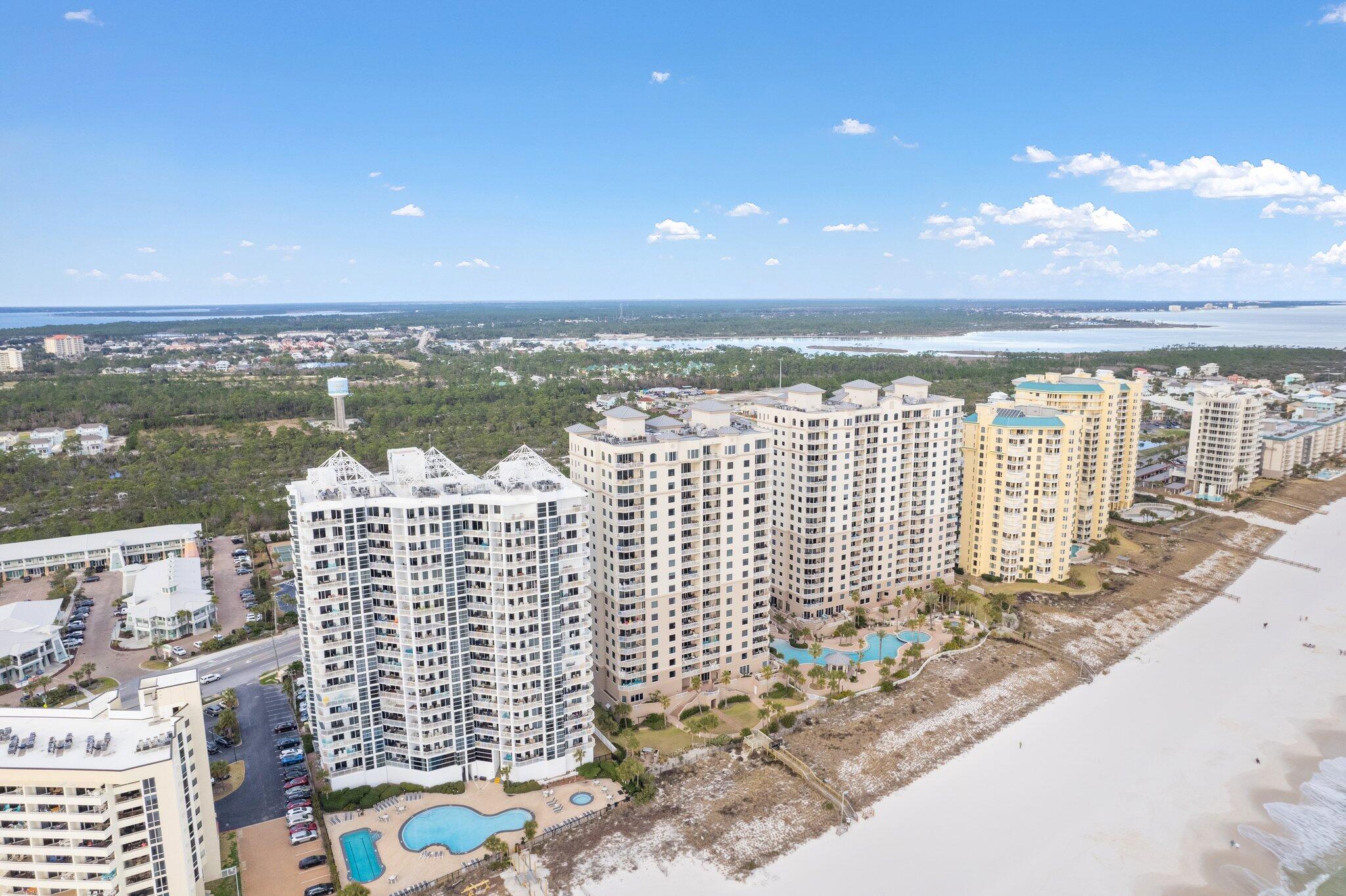 Paradise awaits! Head up to the 10th floor and step inside this stunning beach condo - A 3-bedroom, 3-bath furnished condo where you'll find yourself captivated by the breathtaking views of the Gulf of Mexico that beckon from beyond. This prestigious Indigo residence has never been rented and offers a fully-furnished residence, with all the fabulous features that are essential to provide you serenity and luxury at the beach - NEW interior paint 2023, NEW HVAC with programable thermostat in 2017, granite countertops in the kitchen and baths, stainless steel appliances, and additional custom cabinets installed in the master bedroom. Take a moment to behold the primary bedroom, a haven of tranquility and indulgence, blessed with an uninterrupted vista of the Gulf waters. Step out onto the