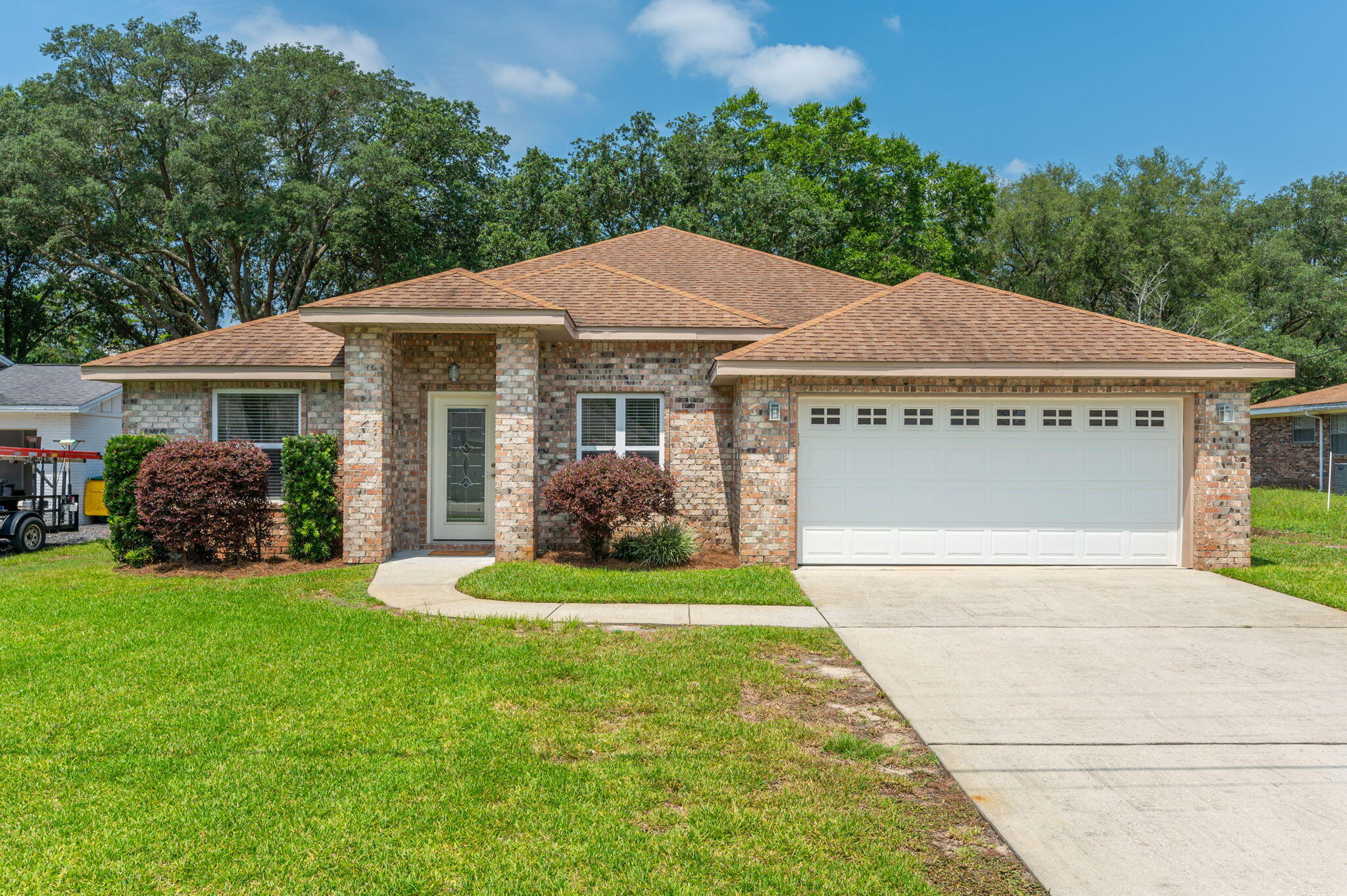 Under Contract with 72-hour kick-out clause in place. Centrally located in the heart of Niceville, find this fantastic all-brick 4-bedroom, 2-bath home outfitted with quality finishes throughout. Brand new engineered hardwood flooring, fresh interior paint, and upgraded trim-work accent the highly functional split bedroom layout. A gourmet kitchen sits at the heart of the home and features exotic granite counters, modern cabinetry, a full suite of stainless steel appliances, and a breakfast bar overlooking the spacious living room. The massive primary bedroom with deluxe en suite bath sit on one side of the living space while three additional bedrooms and a shared hall bath lie on the other side. At the front of the home, discover a flexible and light-filled space perfect for formal
