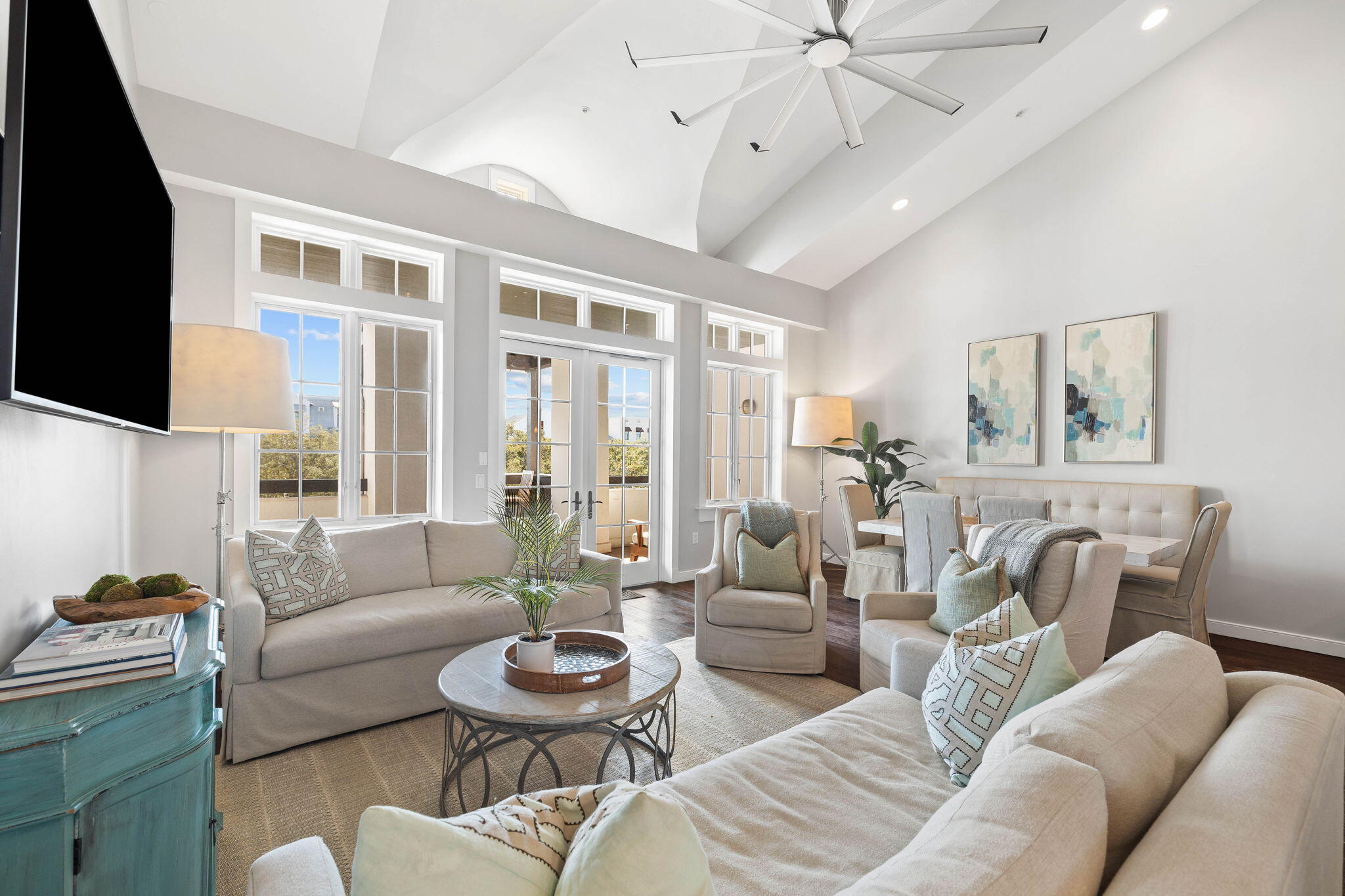 This two-story condo exudes coastal luxury at its very best. Located in the heart of Rosemary Beach, it's steps from boutique shops, restaurants, parks and beach activities. Soaring ceilings grace the first floor, creating light and airy spaciousness in the living room anchored by dark wood flooring. Doors open onto a large balcony, creating a seamless indoor/outdoor lifestyle. The gourmet kitchen is a chef's delight with glossy white cabinetry, a mosaic tile backsplash and a full range of stainless steel appliances. Pull up a chair at the breakfast bar for informal dining and socializing. Three bedrooms plus a bunk nook in the hallway cater to family gatherings and beach vacations. Two bathrooms, including one ensuite, serve two guest bedrooms on the first floor. Head to the second floor, where a loft area provides a second sitting area. A wet bar and a second dining area on the mezzanine make this an ideal home for multi-generational families and those who love to entertain. The master suite is a true haven of tranquility with a king-sized bed and a swanky bathroom to match. Carrara marble and glass tiles enhance the en-suite and walk-in shower. A private balcony provides a place for owners to retreat and enjoy leafy views while reading a good book. This stylish home is ideal for buyers looking for a low-maintenance, turnkey property in this sought-after enclave. Centrally located, it enjoys leafy park views and is within striking distance of town center activities. Amenities include a fitness center, racquet club, and four community pools, including a lap swim pool and an owners' only pool. Keep fit on the 2.3-mile fitness trail, explore the tranquil butterfly garden, browse the farmers market and relax in multiple parks and green spaces. For beach lovers, nine beach walkovers provide access to the stunning white sand and 2,500 feet of private beach.

