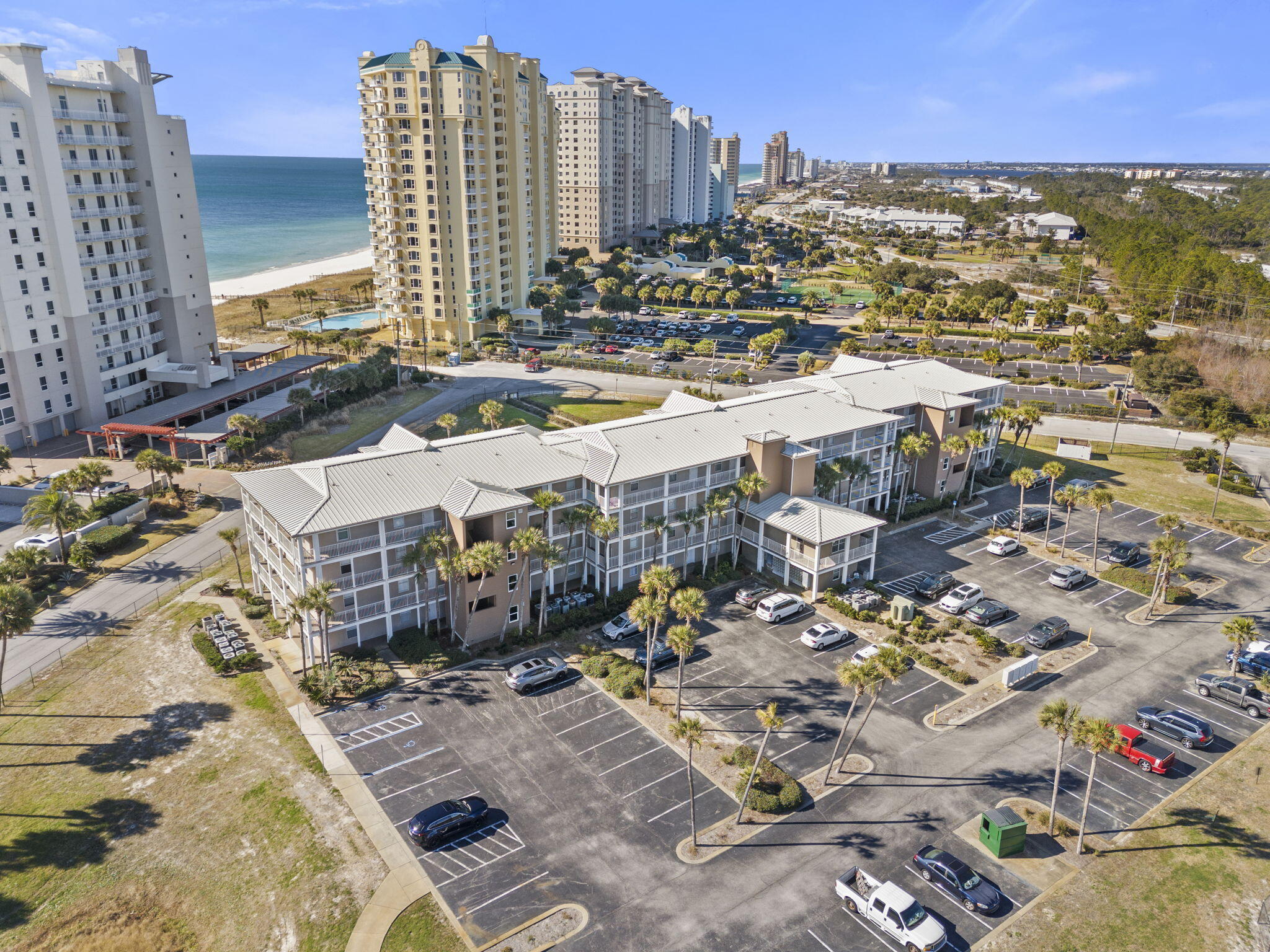 Escape to your own slice of Gulf Coast paradise at Grand Caribbean #302W! This beautifully furnished one-bedroom, one-bath condo, complete with a cozy bunk alcove, offers the perfect blend of comfort & coastal charm. Step inside to an inviting open floor plan, where natural light enhances the interior updates, including plush carpet, chic kitchen cabinets, sleek countertops & fresh furnishings--all upgraded in 2021. A new HVAC and water heater, also installed in 2021, provide peace of mind. Unwind on your private balcony, where the Gulf view and breeze invites pure relaxation. Grand Caribbean's gated community provides you with resort-style amenities, from a seasonally heated pool & bubbling hot tub to a BBQ area perfect for sunset cookouts. With direct beach access, your days can be fille
