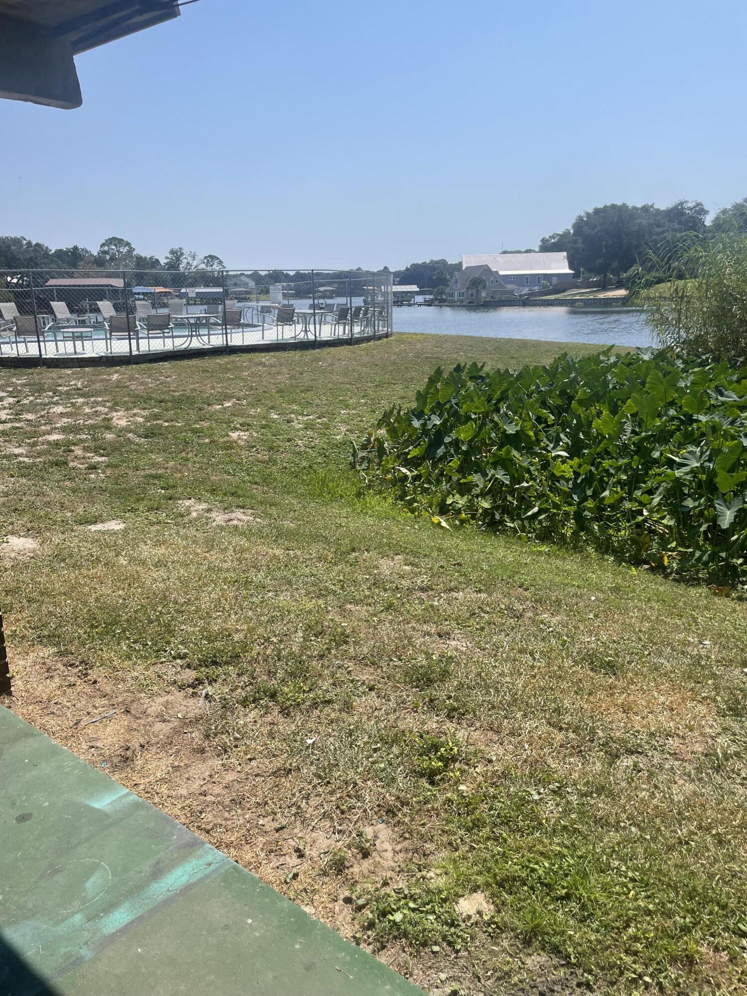 INVESTOR SPECIAL. Unheard of opportunity to own a waterfront condo for under 90k. HOA dues for only $230 month covers dock, pool, grounds, water, trash, security, pest control and exterior insurance. Roll up your sleeves and give this prime location an interior refresh. Cash only. No short term rentals allowed. 6 month lease minimum. These rent for $1400-$1500 a month.