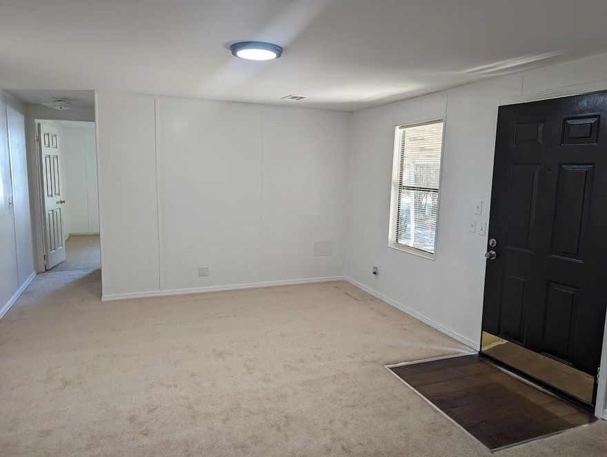 Welcome to your pet-friendly oasis! This charming mobile home boasts fresh carpet and newly painted walls, providing a cozy haven for you and your furry friends. Conveniently located just a 10-minute drive from the Whiting Field Naval Air Station, this residence offers easy access for military personnel. With a covered carport and affordability in mind, this home combines comfort and practicality, making it the perfect retreat for you and your pets.