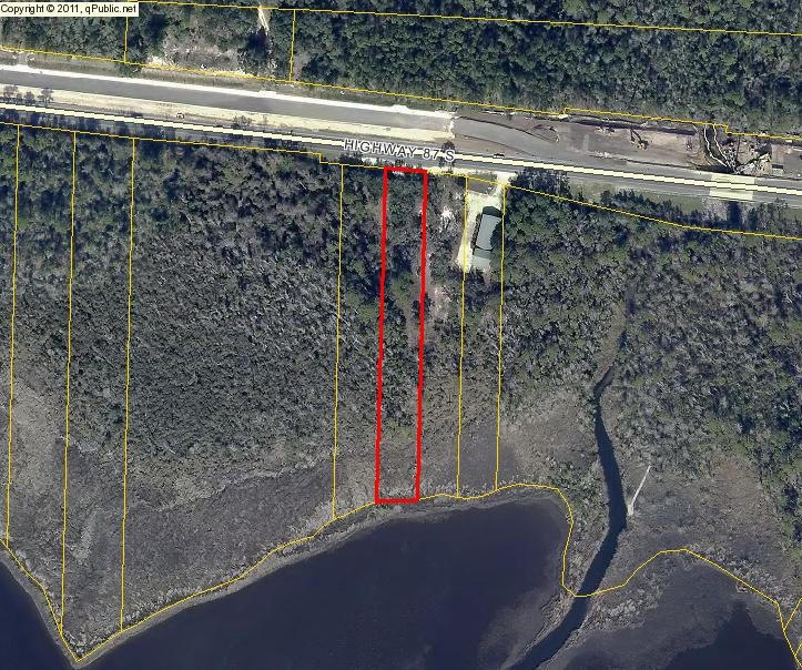 REDUCED $29,000! WATERFRONT !! Great Bay Front Lot located with 75 ft on the Bay and 677 ft deep. Easy access to Navarre Beach, shopping and dining. Plenty of privacy, great sunsets and PRICED TO SELL.