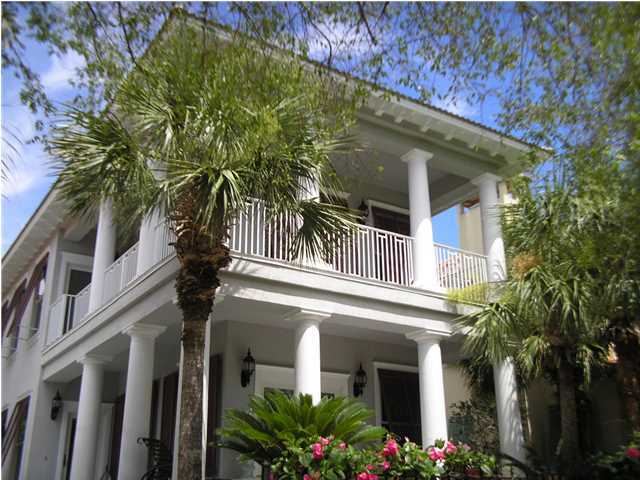 Beautiful Home In The Neighborhood Of Caribe. You Enter Home Through An Open Living Room With Soaring Ceiling And Windows Galore. The Kitchen Overlooks The Dining & Living Areas. On The Exterior Of The Windows Are Bahama Shutters. Interior Of The Windows Are Plantation Shutters On Almost Every Window. There Is Crown Molding Everywhere Including The Closets. Tile And True Hardwood Floors Throughout The Home - No Carpeting. The Master Bedroom Is On Main Level As Well As A Powder Room Half Bath. Two Large Guest Bedrooms Upstairs With Access To The Wonderful Balconies On This Home. You Will Love Sitting On One Of These Enjoying The Gulf Breezes. The Home Is In Excellent Condition And Ready For New Owners. You Must Put This Home On Your List To See What It Has To Offer. Call To See It Today