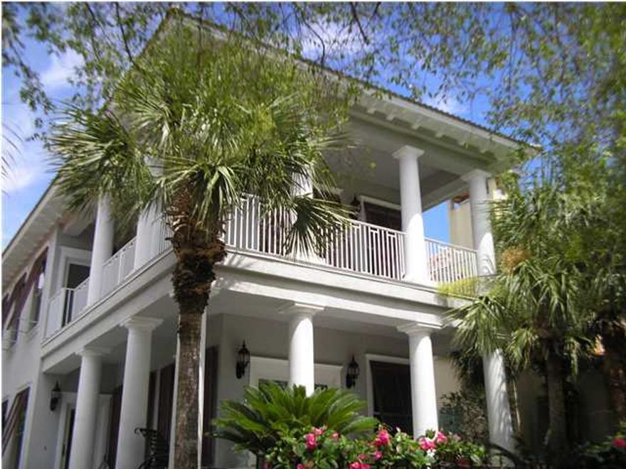 Beautiful Home In The Neighborhood Of Caribe. You Enter Home Through An Open Living Room With Soaring Ceiling And Windows Galore. The Kitchen Overlooks The Dining & Living Areas. On The Exterior Of The Windows Are Bahama Shutters. Interior Of The Windows Are Plantation Shutters On Almost Every Window. There Is Crown Molding Everywhere Including The Closets. Tile And True Hardwood Floors Throughout The Home - No Carpeting. The Master Bedroom Is On Main Level As Well As A Powder Room Half Bath. Two Large Guest Bedrooms Upstairs With Access To The Wonderful Balconies On This Home. You Will Love Sitting On One Of These Enjoying The Gulf Breezes. The Home Is In Excellent Condition And Ready For New Owners. You Must Put This Home On Your List To See What It Has To Offer. Call To See It Today