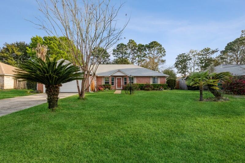 Fantastic home in Raintree Estates, well maintained and updated. This home boast a renovated kitchen with softclose cabinets, granite and stainless appliances, wood flooring throughout the main living areas as well as a masterbath with tile shower and a garden tub. If you are looking for a home with close water access this is it, Raintree has an amazing beachfront park where you can enjoy many outdoor water activities and amazing sunsets. You can also be in Destin within about 10 mins to enjoy the gorgeous white sand beaches of the Gulf. The seller has taken great pride in this home, the roof was replaced in 2021, hotwater heater in 2022 and the HVAC system in 2017, also all but two windows have been replaced with impact windows to include the sliding glass door. Don't miss this one!