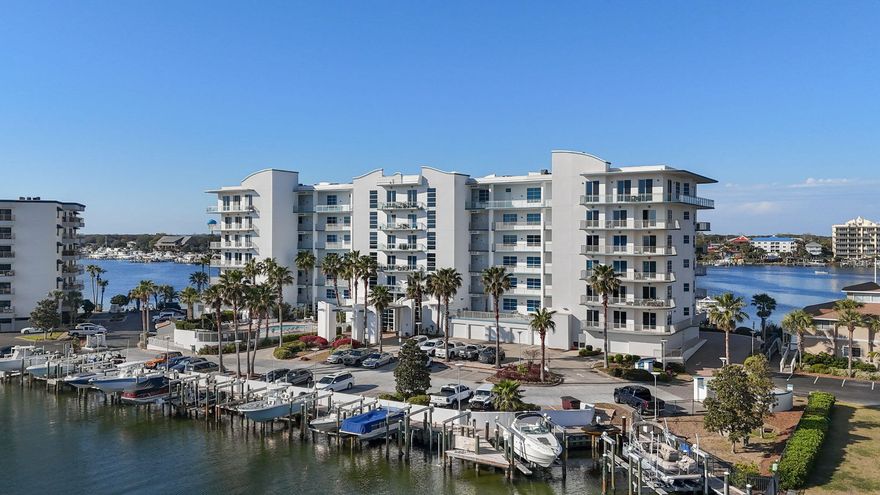 Largest boat slip currently available in Destin Harbor conveys with the sale of this property! Slip offers ample space for an ultra-large yacht or the option to accommodate an off-shore and in shore boat. The unit is open concept with East Pass, Harbor, and Gulf views. Be a master chef in the large, gourmet kitchen with granite countertops and custom cabinetry. Plenty of storage here with large upper and lower cabinets and walk in pantry. Take in the views from the eat in kitchen or dining area with space enough for 8 seats. With over 600 sq ft of wrap around balcony space, you have the picture perfect setting. Relax in the luxury primary suite with ensuite bath, with an additional 2 beds and 2 baths for friends and family. Storage locker and deeded garage