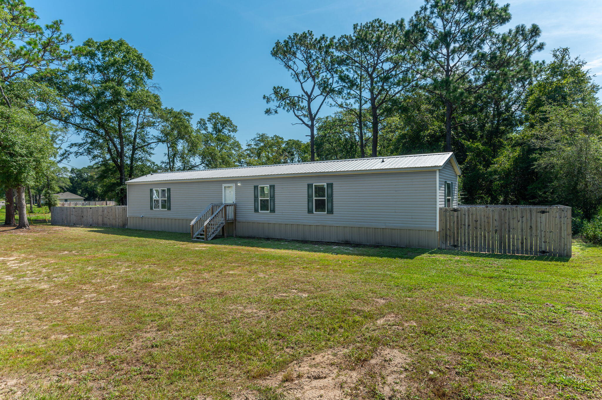 Check out this 2019 home on approximately a quarter acre. This 3 bedroom, 2 bath home is just right for a person/family starting out or for someone wanting to scale down and minutes from town. You will find a yard building in the fenced in back yard. This property won't last long! Contact me today to schedule a showing. The washer/dryer and TV will convey with property, but as is.