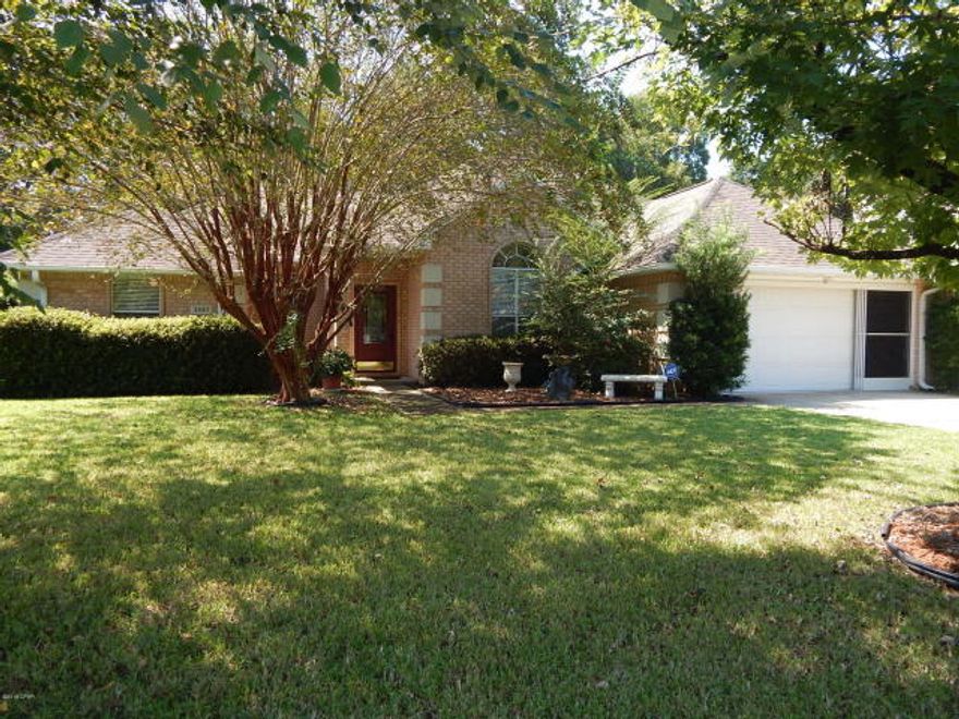 This 3 Bedroom/2 Bath Home is a MUST SEE! It has a perfect split floor plan, 2 car garage, a Sun room, a Greenhouse and a studio house out back!! Recent updates include: New porcelain tile floors, new light fixtures and ceiling fans, new front door and updated sprinkler system. Master Bath has Handicap Provisions and a big Walk In Closet. This lot is beautifully landscaped and has a private fenced in backyard. The Greenhouse is great for all of your gardening desires or storage area. Studio home is excellent for guests and comes equipped with an AC/Heater Unit along with a Sink. The sun room would make for another bedroom or a peaceful place to relax. Living room has 10ft high ceilings, a large bookcase that lights up, and a fireplace. This Home has so many wonderful things to offer.