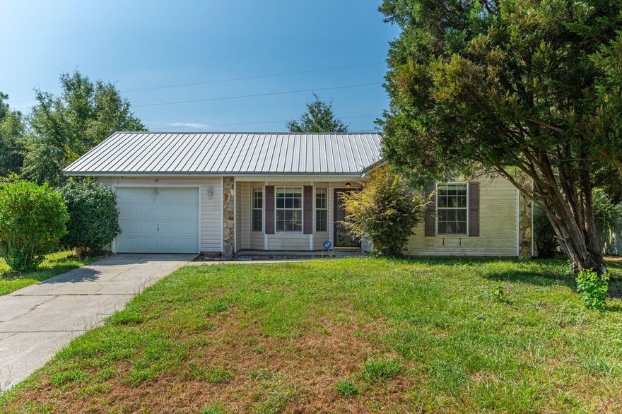 This 3 bedroom, 2 bath, 1 car garage home is centrally located and ready for you!  The living room area has high ceilings and wood laminate flooring. The kitchen has a breakfast bar and fridge, stove/oven, microwave, and dishwasher. The bedrooms are a split bedroom floor plan and all have new carpet. Outside boasts a screen porch, storage shed, and a very large backyard space. One car garage for storage needs and lots of driveway parking as well. Come by and check out this property for rent!