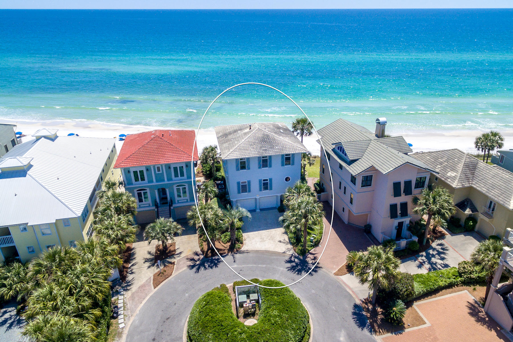 Found in the heart of Blue Mountain Beach, this expansive, Gulf-front beach house offers 4 spacious suites, a bonus bunk room, and coveted outdoor entertainment spaces with turquoise views that dreams are made of. This three-story home can be found south of Scenic 30A on a quiet cul-de-sac of the Grande Beach community. Offering a welcoming covered front porch and a spacious foyer, this home was made to entertain guests with separate guest quarters that can be accessed through the home's expansive two car garage. Guests will enjoy an expansive one bedroom suite, a bonus bunk room and direct access to the home's lush beach-front green space and the sugar white-sand beaches of 30A. The second level of the home features an open concept great room meant for gathering, featuring a soaring