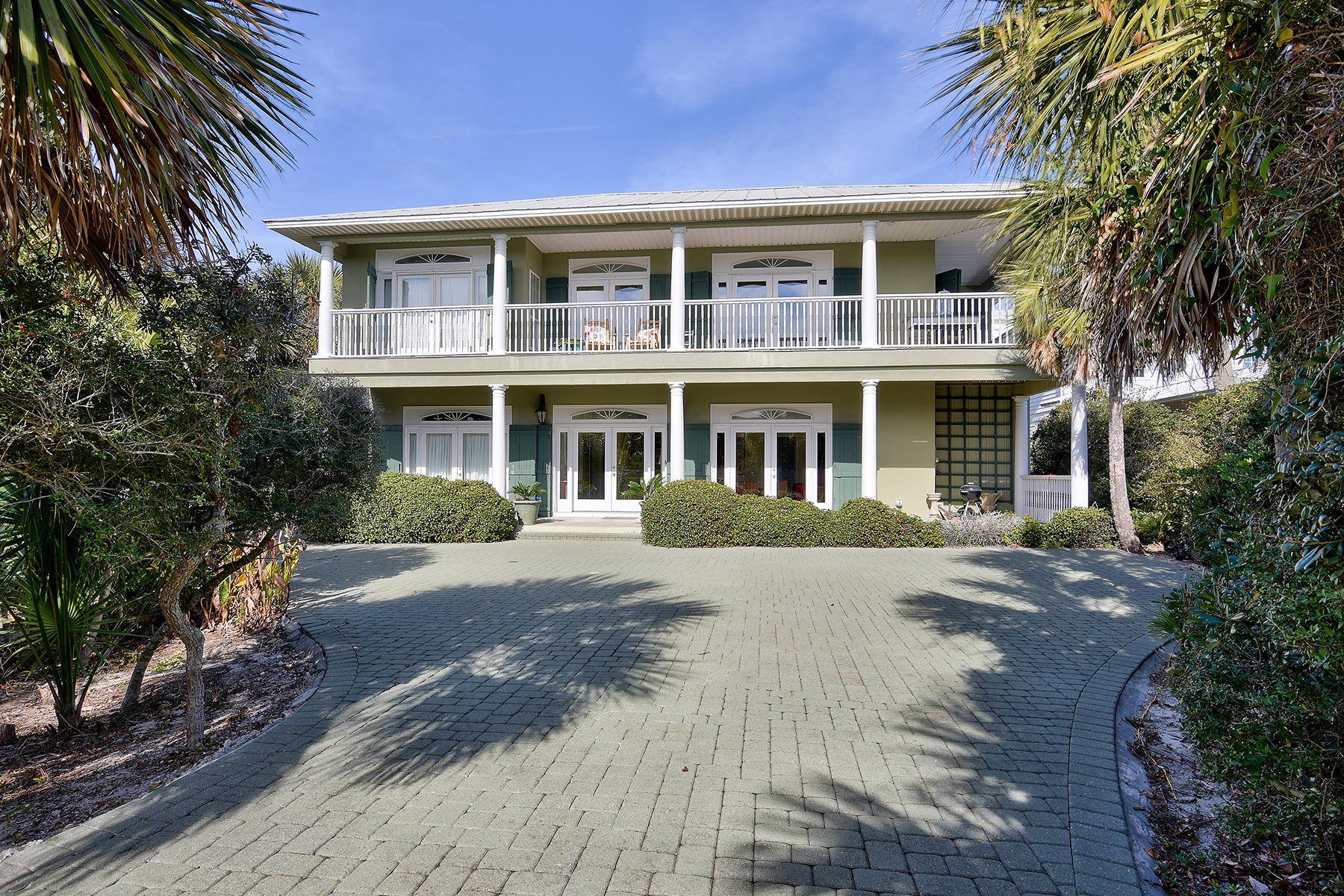 Two neighborhood beach access points are fewer than 150 yards from this home with elevator in Blue Mountain Beach. Built to equally suit vacation or year-round living, this home is offered fully furnished with some exceptions and immediately ready for primary, 2nd home, or rental use. Its many spacious living areas with Gulf of Mexico views allow family and friends to gather while entertaining or spread out for privacy. The living area on the 1st floor features built-in book shelves and bar with sink and refrigerator. A sleeping porch is perfect for guests. The enormous 2nd floor living area also features built-in book shelves along with a fireplace a wide-plank hardwood floors. It is open to the kitchen with granite counters and stainless steel appliances, perfect for entertaining.