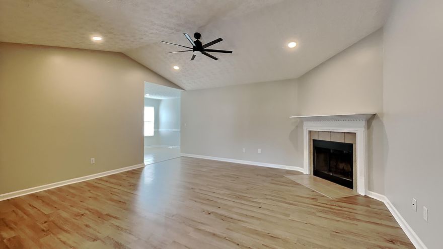 This beautiful residence has been prepared for its next family, boasting fresh paint throughout that gives the entire home a bright and welcoming atmosphere. Step inside to discover brand new flooring that complements the home's modern aesthetic, ensuring a clean and contemporary look in every room. The layout is designed for comfort and functionality, perfect for family gatherings or quiet evenings at home.