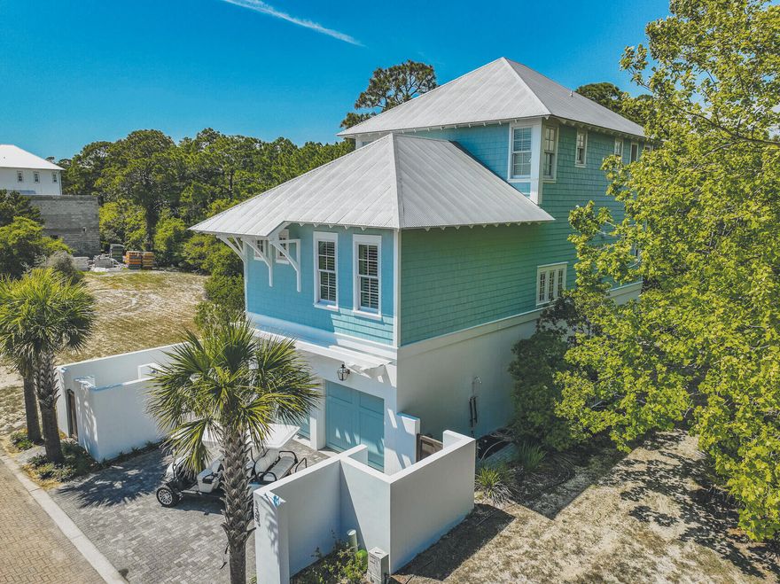 Tucked behind the gates of Seanest Village in the heart of Seagrove Beach, this beautifully crafted 4 bedroom, 4 bathroom coastal abode offers a rare combination of privacy, quality, and location just moments from the white sand and emerald waters of the Gulf.Set against the peaceful backdrop of Point Washington State Forest, the home enjoys a rare sense of serenity with no neighbors behind, just a canopy of trees and the occasional deer sighting. Deeded beach access is conveniently located just 1/4 mile away at Loggerhead Lane, making toes-in-the-sand time easy and effortless. Spanning over 3,100 square feet across three levels, the layout is designed for both gathering and retreat. On the main living floor, an open-concept kitchen, dining, and living area is filled with natural light and coastal charm. Granite countertops, a large center island, and custom cabinetry provide plenty of space to cook and entertain, while Pecky Cypress ceilings and hardwood floors add warmth and texture throughout. A screened-in back porch extends the living space outdoors and invites you to grill, dine, and relax while enjoying uninterrupted forest views.

Each level of the home offers a private bedroom suite, including two master bedrooms with vaulted wood ceilings, generous closets, and spa-like bathrooms with soaking tubs and custom tile work. The third-floor media room is the perfect place to unwind, and a private balcony off the top-level bedroom provides a peaceful perch above the trees.

The home comes furnished (with a few exclusions), and features a two-car garage, ample guest parking, an outdoor shower for rinsing off sandy toes, and a cozy front courtyard perfect for al fresco dining.

Seanest Village is a small, gated community known for its charm and beauty, complete with a stunning infinity pool and a friendly, low-key atmosphere. Just minutes from great dining, shopping, and the bike trails that connect all of 30A, this home offers the best of coastal living, whether you're settling in full-time, escaping on weekends, or seeking a smart investment in one of the area's most beloved neighborhoods. Contact us for a private showing.
