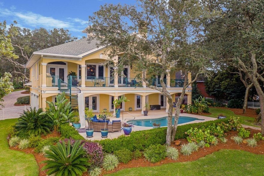 Outside of the bustle of beach activity but only 20 minutes from putting your toes in the sand is this 4,072-sq.-ft. home situated on a .65-acre lot directly on Lake Lorraine in Shalimar. This three-bedroom home in Lake Lorraine Gardens offers 180-plus feet of water frontage and direct bay access with its own private dock boasting boat and jet ski lifts. Privacy abounds from this Old Florida-style home, which has been meticulously maintained and features a private heated pool and brick paver patio area with a fire pit overlooking the water.