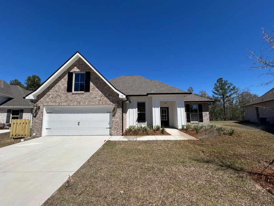 The ROSES V G in Bird Song at Hammock Bay community offers a 3 bedroom, 2 full bathroom, open and split design with flex space and computer desk/niche. Upgrades added (list attached).  Features: double vanity, garden tub, separate custom tiled shower, and 2 walk-in closets in master bath, tray ceiling in master bed, kitchen island, walk-in pantry, covered front/rear porch, crown molding, recessed lighting, framed mirrors, smart connect WIFI thermostat, smoke/carbon monoxide detectors, landscaping package, architectural 30-year shingles, flood lights, and more!Energy Efficient Features: water heater, kitchen appliance package, vinyl low E windows, and more! Energy Star Partner.