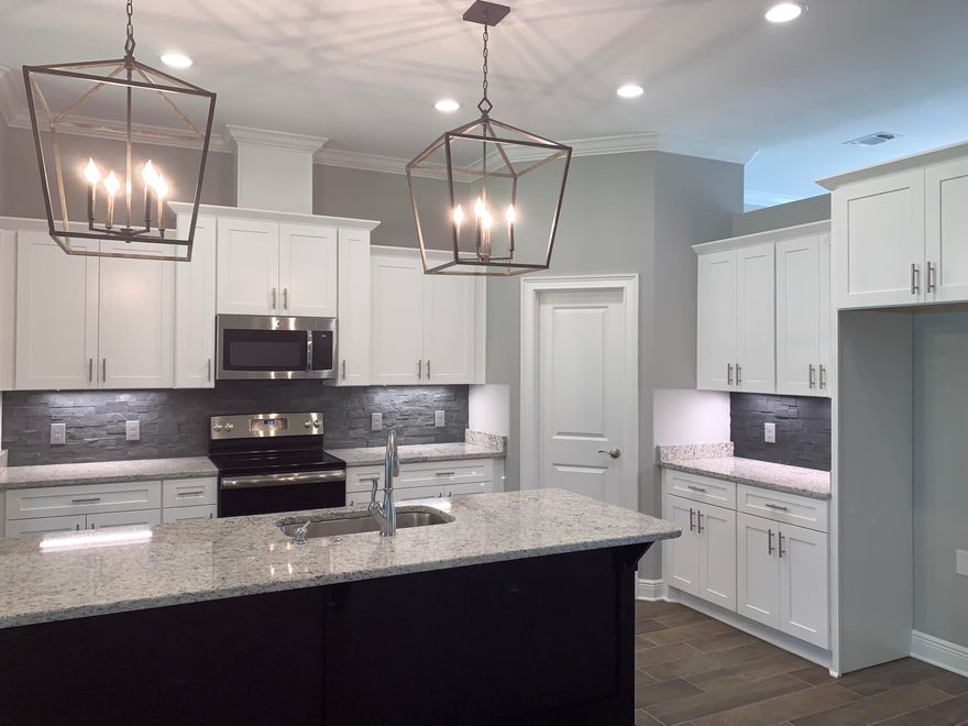 NEW CRAFTSMAN Custom Built Home in Holley By The Sea,Enjoying all the Club House amenities including :Pools,Fully Equipped Gym,Tennis Courts,Waterfront Park & Deeded Access to Santa Rosa Sound This luxurious 4 bed/3 bath Tri split floor plan is under construction...and will be ready in time for your Summer move in ~Desirable Location within HBTS..with easy access to Navarre Beach, shopping and Hwy 98 to Hurlburt Field AFB.This Stunning Robbins Builders Custom Home~offers trend setting design & features~Greeted by a walk in foyer open to the Formal Dining and Office with double glass doors/sweeping through to your open floor plan ~Large Gourmet kitchen enjoying custom cabinets with crown molding beautiful granite counter tops~Tiled Back splash~ Under Mount Sink~S/S Appliances~ ~Center Island with open flow to the breakfast nook and family room, Wood Plank Staggered Tile through the foyer,dining room, main living area, laundry and bathrooms. Large Master with trey ceiling & ceiling fan. Master bath offers a large tiled walk in shower /separate soaking tub~Granite double vanity with brushed nickel fittings/picture frame mirrors & Huge walk in closet.Two additional bedrooms are a great size with ~ ceiling fans and share a large Jack'n'Jill bathroom with separate closed off vanity /dressing areas and joint step in tub/shower and WC.Third additional bedroom is separate from the other rooms and would make a perfect guest/teen suite with its own bathroom and access out to the large covered porch.Laundry room is very spacious with a recessed area to accommodate an additional refrigerator or storage shelves...flows through to the over sized 3 car garage 31 x 23...ideal for the larger trucks and still plenty of room for all the outdoor toys. Home is situated on one of the larger lots with grassed yard'~ privacy buffer~sprinkler system~ lawn pump and well with digital programmable timer for easy care. TAEXX in wall pest control system~ Fabric Shield Hurricane protection and dimensional shingle roof for lower insurance premium. Upgrades include crown molding, bull nose corners ,knockdown ceilings, recessed lighting ,framed mirrors, deluxe lighting package,50 Gallon water heater, garage door remotes, attic drop down stairs~ to name a few...Call today for further information colors and construction status.
******Photos are of a previous home so colors and fixtures may change.