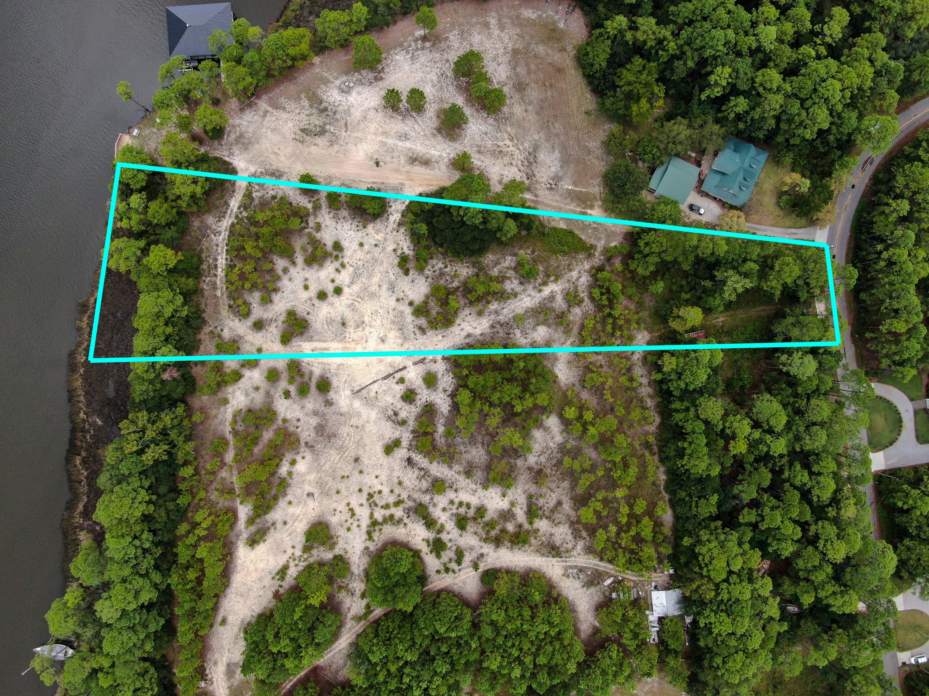 OVER 2 ACRES with approx 150 feet of FRONTAGE on the INTRACOASTAL. This rare and beautiful lot is high and dry. Ideal for someone who values privacy and tranquility, while still being only minutes from the beautiful 30A beaches, local restaurants and grocery stores. Located on a paved road, along the the Intracoastal Waterway, this lot has approx 150' frontage, perfect for launching a kayak or paddle board right out to the Bay! Build your dream home among the beautiful native Longleaf Pines, Magnolias & Palmettos with stunning views from every floor. NO HOA