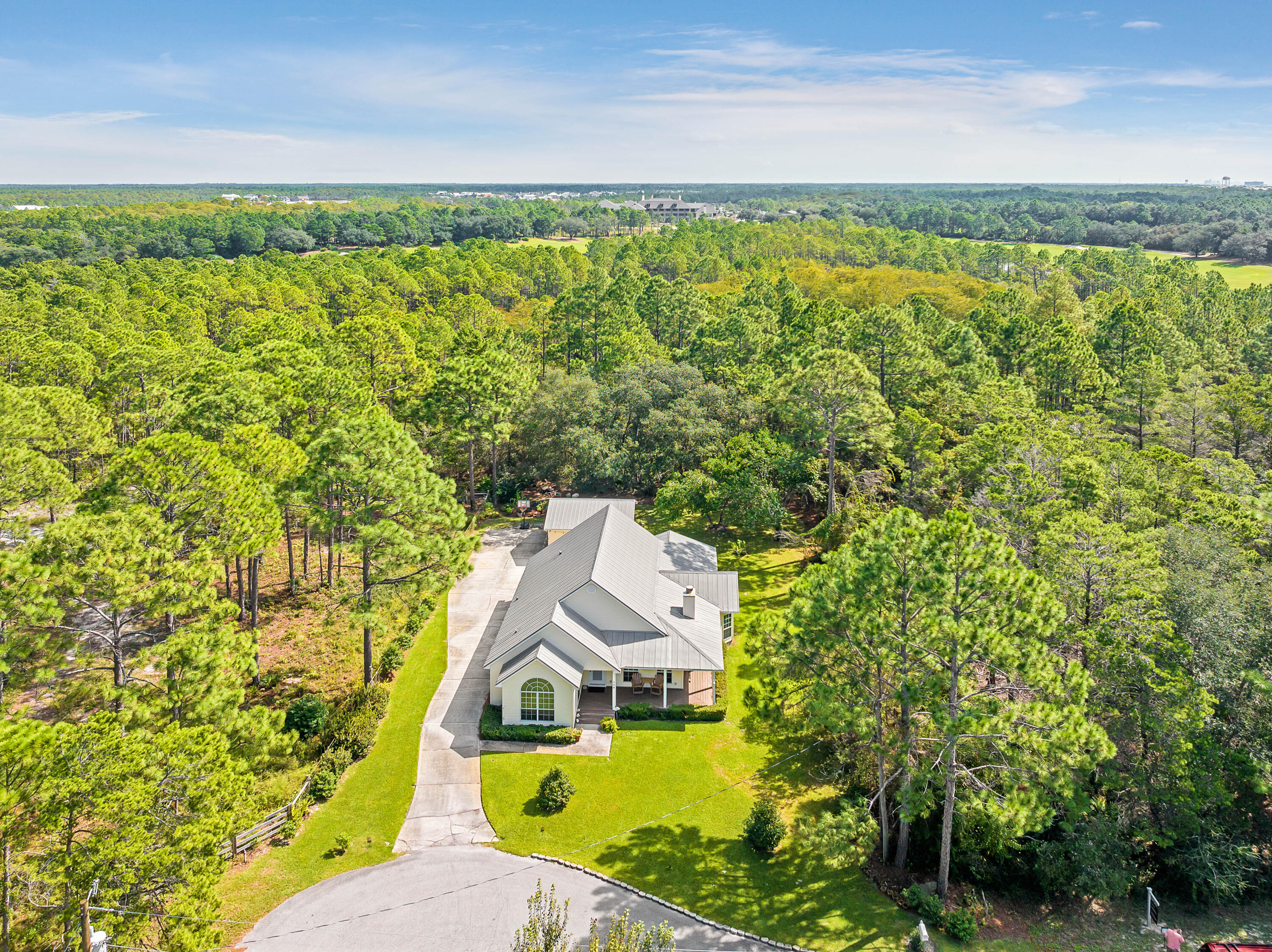 Charming Coastal Home in Seacrest!Welcome to 548 Seacrest Dr., a beautiful 3-bedroom, 2-bathroom home tucked away on a quiet cul-de-sac in the sought-after Seacrest community. This spacious 1,681 sq. ft., single-story gem is set on a large lot, backing onto a peaceful nature preserve and the pristine Camp Creek Golf Course, offering incredible privacy as it is surrounded by natural beauty. Inside, enjoy the light-filled space with lots of windows, vaulted and trayed ceilings, and rich bamboo flooring throughout. The kitchen has been recently updated with new Samsung stainless steel appliances, making it perfect for both casual meals and entertaining. The cozy living area features a warm fireplace, ideal for relaxing evenings. The spacious master suite includes a luxurious whirlpool tub, stand-alone shower, and a private water closet for added comfort. There are two additional guest bedrooms, a full bath, laundry/utility room and a formal dining room.  The home also has a two-car detached garage and a newer HVAC system that was replaced in 2019, ensuring energy efficiency and comfort year-round. The lot is large and there is plenty of space to add onto the property or add a pool. This property is also just a short walk to the beach, the beach access is just at the end of the street across 30A. Seacrest Drive is close to The Watersound Beach Club, Camp Creek Club and golf course and is close to shopping and restaurants in Seacrest, Alys Beach and Rosemary Beach. This home provides the ultimate coastal lifestyle. It's being sold unfurnished, giving you a blank canvas to personalize. Whether you're searching for a full-time residence or a vacation getaway, this peaceful retreat on a dead-end cul-de-sac is a rare find on 30A!
