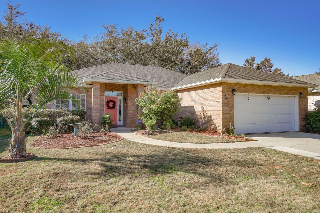 This is the one you have been waiting for... all brick 3 bedroom 2 bath home with over 1700 sq. ft in a great neighborhood. Built by one of the local area's best builders, this home features a raised ceiling in the living room, open floor plan with a flex space that can be used as second dining, second living or office space. Airy and bright living room has corner gas fireplace and double French doors that open up to the screened porch. The kitchen offers granite counters, a breakfast bar, and 42 inch beautiful wood upper cabinets. The master bath offers dual sink vanity, huge garden soaking tub and oversized separate shower. Master bedroom features a walk in closet and large bright windows. Roof was replaced in 2014, the water heater and refrigerator were replaced this year. Con't...