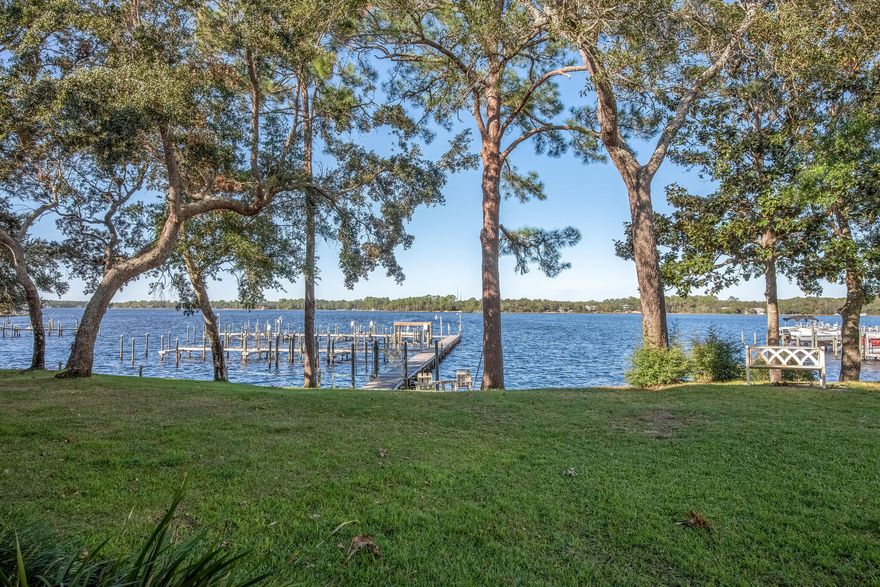 Waterfront end unit with boat slip and watercraft lift. Your own little piece of paradise. Boating , fishing,  jet skiing or just  enjoying  the tranquility of the bay then this is the place for you.The view is magnificent from the screen in patio with majestic oak trees in a park like setting. Bright, spacious 2 story 3 bedroom, 2.5 bath town home with attached garage. Well appointed kitchen with custom cabinet, granite and high end appliances. Inviting living and dinning area with water view. The second story consist of the 3 bedrooms and 2 full bath. Nice size  master bedroom with balcony to again enjoy the water view. The master bathroom  features new cabinet with quartz counter, and there is plenty of storage with walk in closet. One of the guest bedroom has built in corner desk and a Murphy bed. Washer and dryer area located on second floor. No carpeting in this unit. Roof is 4 years young.  Hidden Bay subdivision offers a community pool, beach area and  is steps away from Hidden Creek golf course. Conveniently located near beach, shopping and schools. Only 12 miles to Hurlburt Field. Will not last long. Make your appointment today.