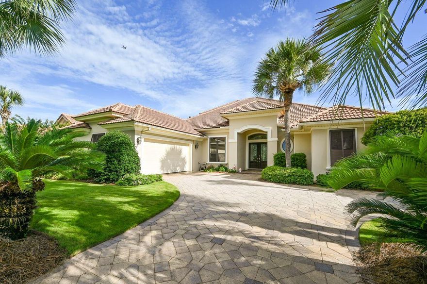 Welcome to this beautiful golf course home located in the gated community of highly sought-after Regatta Bay. Nestled on the 4th fairway, it enjoys a panoramic view of the course and a 63-acre nature preserve. As you enter the grand foyer through the double leaded glass mahogany doors, you are greeted by soaring 12' ceilings, extensive moldings, indirect lighting, and gleaming tile floors. The formal dining room boasts columned archways and a special display cabinet with a mirrored buffet. The formal living room provides the warmth of a ventless gas fireplace and a wall of sliding glass doors that lead to the spacious lanai and private pool area. The gourmet kitchen is a Chef's delight, featuring custom Arizona Alderwood cabinets, granite countertops, double ovens, double microwaves,