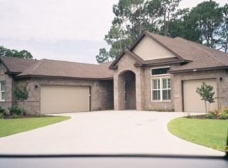 Come take a look at this beautiful 4 Bedroom 3 Bath 3,051SF home in Bluewater Bay. Features include an open floor plan with dark hardwood floors in the living areas, tile in the baths and carpeted floors in the bedrooms. Other features include high 12' ceilings, plantation shutters, custom cabinets, and double garage. The beautiful kitchen features granite countertops, stainless steel appliances and gas range. High end finishes abound. Lay out on the lanai/patio or Take a dip in the pool with waterfall feature. Play golf, tennis, fish or boat at the near by marina.