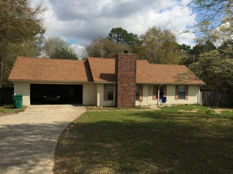 South of I-10! Call today to view this 3BR/2BA ranch style home on a large, wooded, and acre lot! The roof has recently been replaced (2013)! Home has added laminate wood flooring in the hall and living room and carpet in the bedrooms. The kitchen has painted cabinets with new hardware and the dishwasher, stove, refrigerator, and built in microwave. The kitchen overlooks the deck and back yard! Walk through the sliding glass doors to your large back deck! The master bedroom also has French doors which lead to the large deck. Both the kitchen and bathroom have been updated. There is a wood burning fire place in the living room and vaulted ceilings. Pet considered on case by case basis.