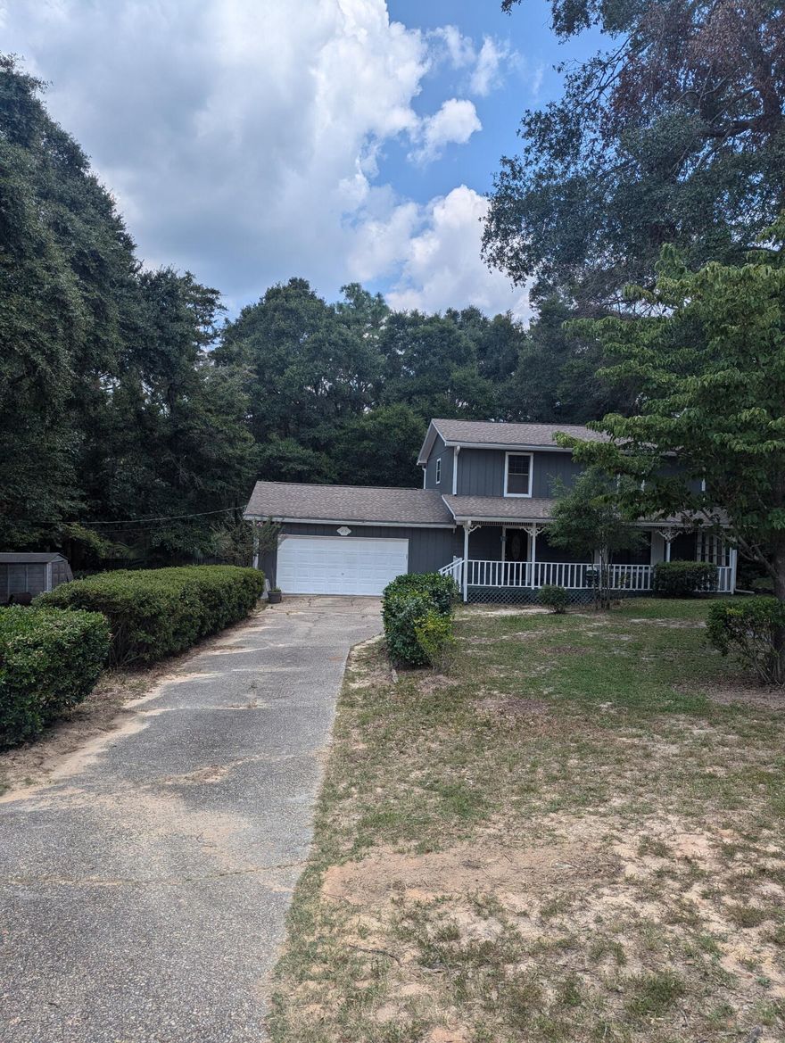 Beautiful home on a 1/2 acre ready for you to move in and make your dreams a reality.   This home has 3 bedrooms and 2 baths upstairs; beautiful kitchen with plenty of cabinet space, spacious living room, dining room, guest bathroom and sunroom round out the bottom floor.