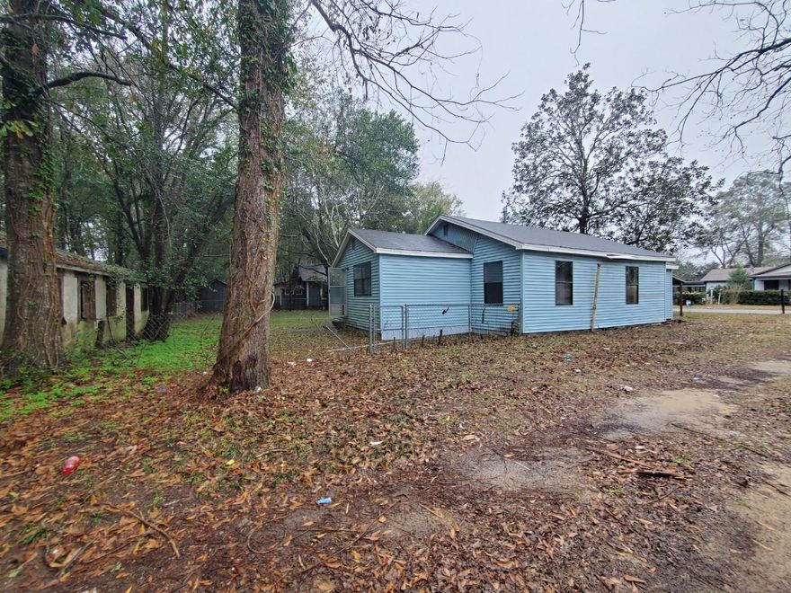 Vacant, SOLD AS IS, Needs New Roof & AC. Great opportunity to make a good flip or rental!  Window glass has been replaced, Interior cleaned out and Yard maintenance done. See Huge incomplete Work-shed at back of property. Room sizes approx. buyer to confirm.