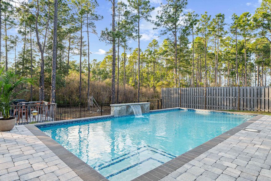 Incredible opportunity to purchase this renovated pool home that backs up to forest views! You won't find a better backyard at this price! Enjoy your own Florida oasis with saltwater pool surrounded by brick paver patio, fire-pit area, deck, and covered back porch. The lot extends into the forest, and there is plenty of room to play or entertain friends. The fence has a 10-ft double gate, making boat storage easy. Peach Creek is a charming neighborhood located minutes from 30A's sugar-white beaches, schools, restaurants, shopping, and is a short drive from iconic Seaside and Rosemary Beach. There is a new walking path perfect for outdoor activities, and food trucks often visit the neighborhood. Head to the beach, swim in the pool, or enjoy Florida living on the back porch. With tons of upgrades, including new quartz countertops in kitchen and bathrooms, luxury flooring, fresh paint, electric fireplace, new light fixtures and fans, custom built master closet, new faucets and more, this one-owner home is move-in ready. This well-designed "Victoria" floor plan features 4 bedrooms, 2.5 bathrooms, a large open living area, and 2-car garage. The beautiful foyer has wainscoting, new light fixtures, and cased-in doorways. The gourmet kitchen features a pantry with custom shelving, extra-large island for additional seating, quartz countertops, beautiful cabinetry with new cabinet pulls and handles, stainless steel appliances, and a spacious dining area with board-and-batten and cased windows. The living room has a fireplace with custom mantle, new ceiling fan, freshly painted walls and ceiling, and cased windows.

The Master Suite is beautiful and has an en suite with double vanity, soaking tub, tiled shower, wainscoting, and huge custom-built master closet with soft close drawers. The 3 guest bedrooms are nice-sized and separated from the Master Suite for privacy. Guest Bedroom 2 has a built-in desk and shelving. The Guest Bathroom has been remodeled and has a double vanity with quartz countertops and shower/tub combo with new shower head. The laundry room has been fully remodeled with cabinets, shelves, and luxury flooring. The half bathroom is renovated and features shiplap and high-end tile flooring. There is also a mudroom space off the garage. Additional features include SimpliSafe security system, irrigation system, privacy fence, 2-car garage with epoxy floors, gutters, and covered front porch. Schedule a showing today! Peach Creek is known for its holiday festivities, friendly residents, and unbeatable location. Can be sold furnished! Buyer to verify all pertinent information in listing.