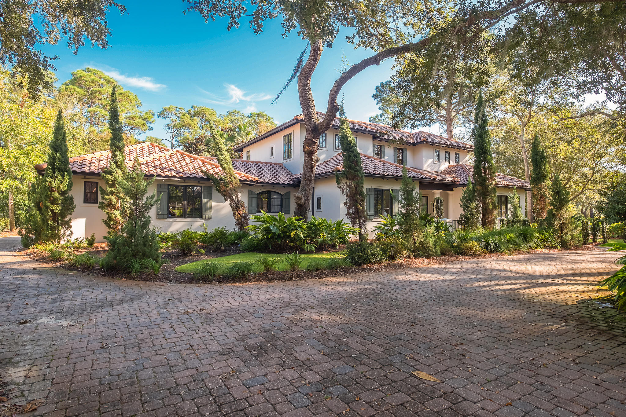 3034 The Oaks on a large, treed corner lot in the much desired Burnt Pine neighborhood. As you enter the renovated gem, you are greeted by a massive Dining Room and foyer and high, coffered ceilings. Next, the kitchen features Thermador and Sub Zero appliances, custom cabinets and quartz counters. It also has a 7' by 7' island with tons of storage and a beverage fridge.  Behind the kitchen is a lovely butlers pantry and pantry closet. The living room has a wall of glass doors overlooking the screened porch and pool area, beamed ceiling, and a gas fireplace. The main floor master suite is huge and also opens on to the porch and pool. The master bath has two vanity areas, shower, tub and two walk in closets. There is also a main floor laundry ,powder room and office. See supplemental info