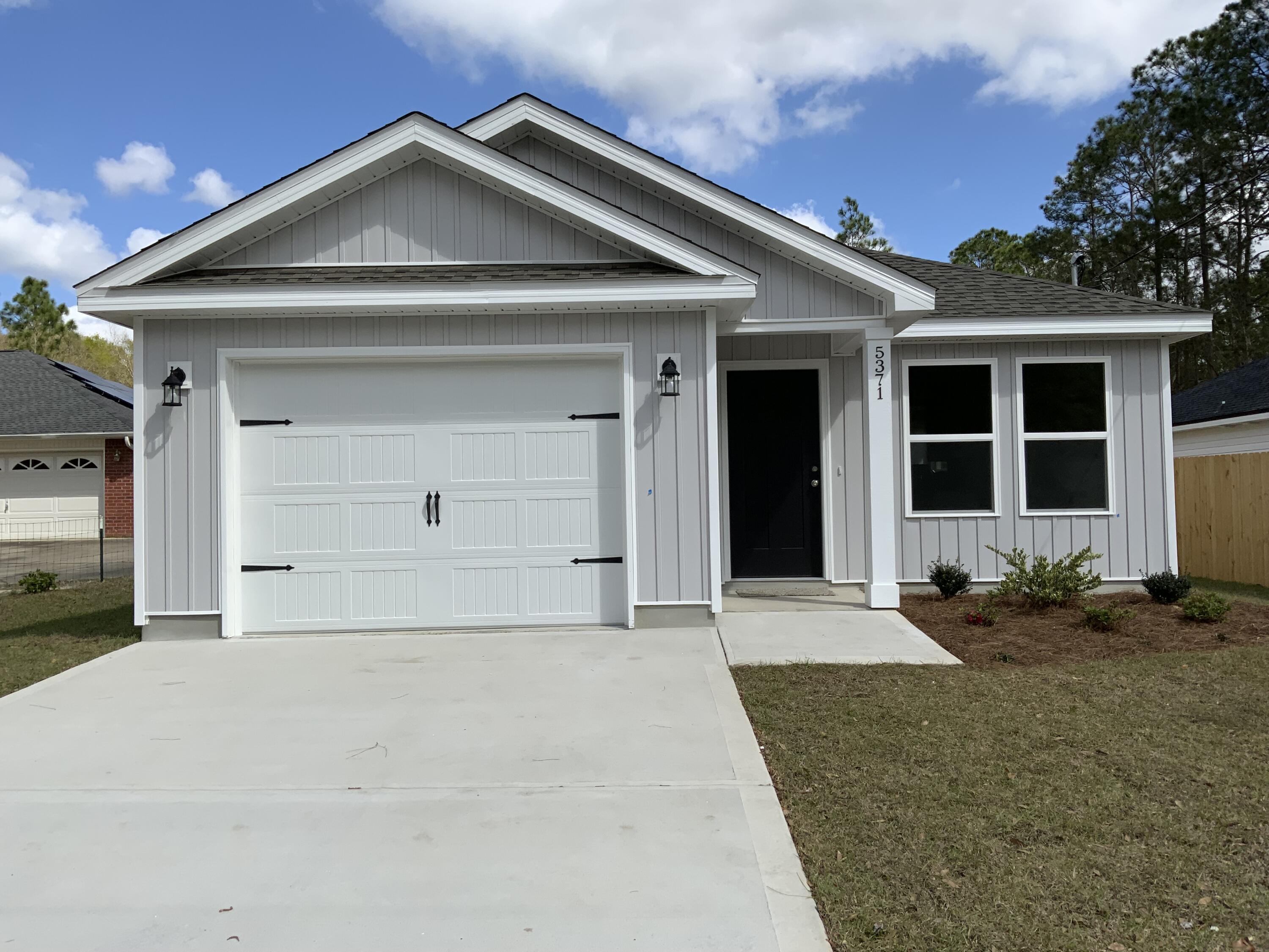 COZY CRAFTSMAN NEW BUILD - NO HOA - NORTH CRESTVIEW - Porches on front and back for relaxing, one car garage, laundry room and back foyer area w/storage closet. The open family/dining/kitchen area boasts raised ceilings, recessed lighting and kitchen work island with bar seating. White shaker style cabinets, walk-in pantry, quartz or granite countertops, stainless steel appliances, luxury vinyl plank flooring in common areas, carpet in bedrooms. Owner suite/bath has double vanities, walk-in closet plus linen storage. Seller will contribute up to $10,000 towards buyers closing costs and/or prepaids and/or rate buydown (restrictions apply). Call for more details.