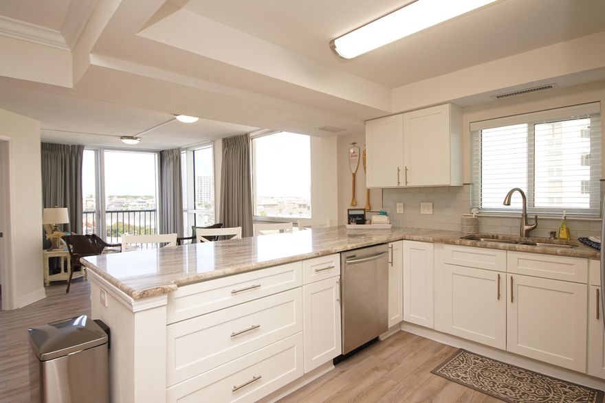 ONE OF A KIND!!  This unique and lightly used, fully furnished, 3/2 1800+ sqft. condo in Shoreline Towers 2 was remodeled to an open concept enhancing the living area while creating a second master bedroom and sitting area with beach views.  Great re-design and plenty of upgrades along the way! Dual A/C zones, stainless samsung appliances, granite countertops, washer and dryer, wood plank LVP flooring throughout. This condo is ideal as a permanent residence, 2nd home or vacation rental. Centrally located shoreline towers is a gated, 24 hour patrolled community on Gulf Shore Dr on the gulf of Mexico. It offers 460' of private white sandy beach, lake, heated pool, lighted tennis courts, sauna, fitness center, large club room with full kitchen and bar, picnic area with gas and charcoal grills shuffleboard, handicapped beach walkover and boat trailer/RV parking. Convenient to boating, fishing, shopping, dining and golf. $48,000 + rental potential. 