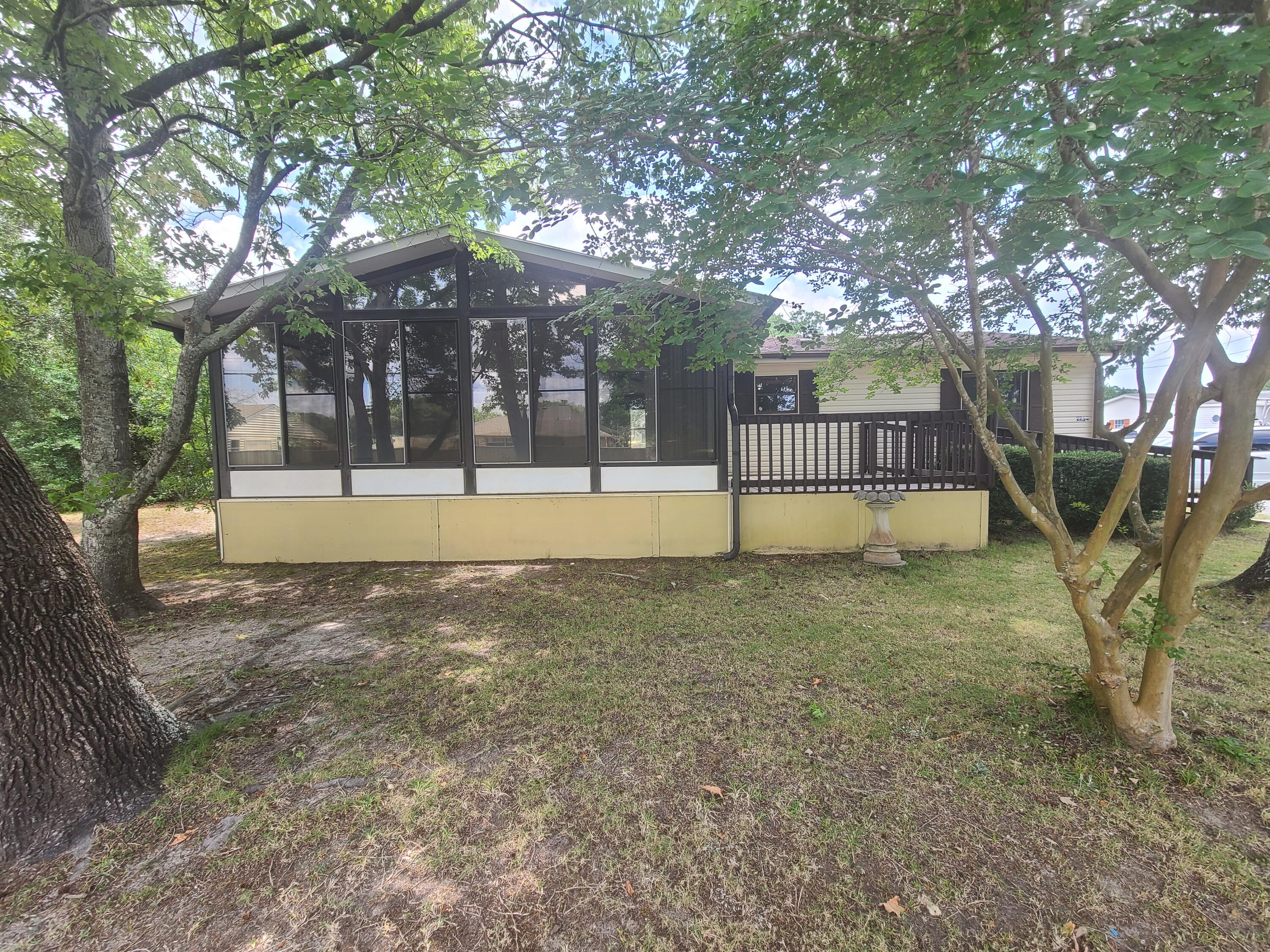 VA - FHA Look at this! Run, don't walk - because in the blink of an eye this one is going to be GONE! Located in Navarre, just north of Hwy 98 and east of Hurlburt Field, within Santa Rosa County, this spacious 3 Bedroom, 2 Bath, 1984 Double-Wide mobile home sits on a large, level lot measuring .33 acres. The property also features a separate 2-car garage/shop with electric and an oversized paved driveway. Originally part of a small mobile home park, there is potential for multi-homes on the property. The home has been well maintained and features a newer roof and HVAC system. Please note that the property is being sold 'AS IS.'