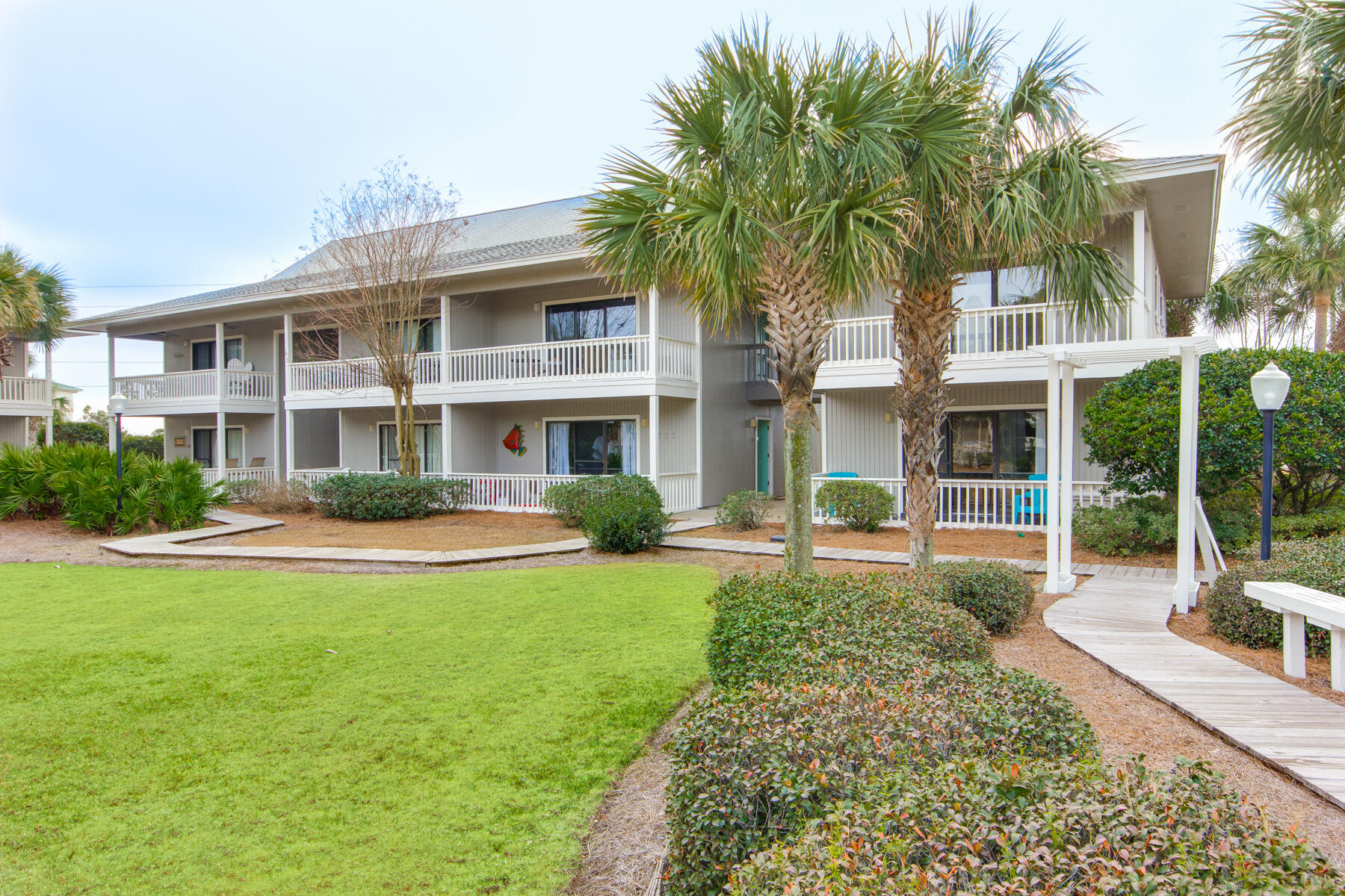 Leave your car behind and walk or bike to everywhere you want to go from this immaculate 1BR/1BA (+ bunks) Beachwood Villas condominium in the heart of Seagrove Beach located right along Scenic Highway 30A. A thoughtful design makes this condo live larger than its square footage with open concept living and dining, a comfortable bedroom suite, and a balcony overlooking a peaceful community green. Beautifully updated, find modern finishes such as quartz countertops, stainless steel appliances, a subway tile kitchen backsplash, stainless steel ceiling fans, custom built-in bunks, glass shower doors, and much more. Beachwood Villas is an established and sought-after Seagrove community with two tennis courts, two swimming pools, a playground, and public beach access directly across the street. Located within walking or biking distance to restaurants, shops, activities, and the neighboring communities of Seaside and WaterColor, this condominium can be a fantastic investment property or a personal retreat in the middle of all that 30A has to offer!