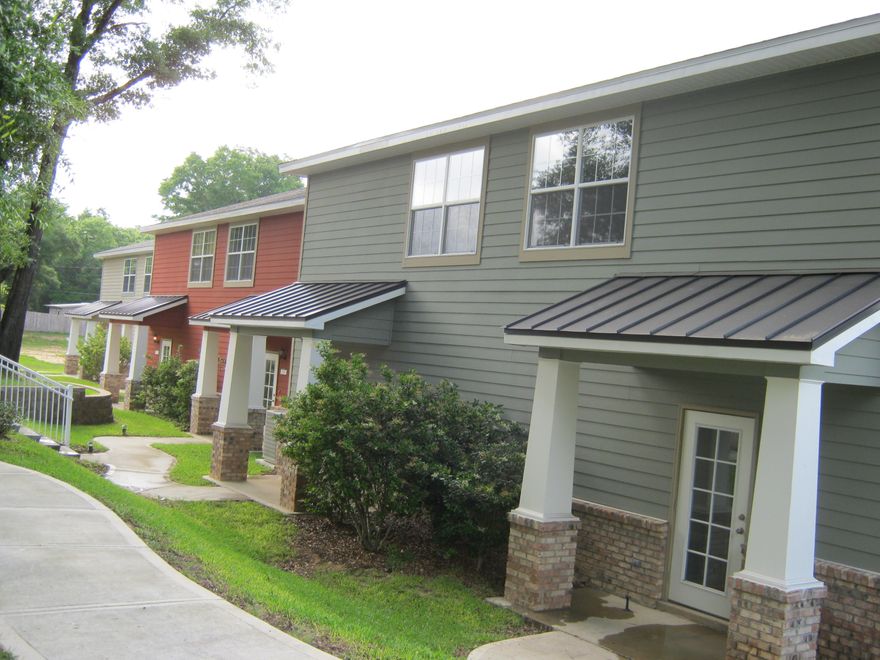 Beautiful unfurnished 2BR/2.5BA townhome in Crestview! Arbor Lake is quietly tucked away from the hustle and bustle of traffic, yet centrally located to the downtown center, restaurants, schools and shopping. Downstairs you will find plank flooring and carpet as well as a spacious half bath that includes a laundry area behind bi-fold doors. The kitchen offers top of the line stainless steel appliances with granite countertops, a large breakfast bar, and plenty of storage in your cherry wood cabinets. The pantry also holds custom made shelving.
French doors are located in the living room and lead to a patio for your cookout gear. Upstairs you will find two bedrooms, each equipped with their own private bathrooms as well as walk-in closets. An additional linen closet is located in the ha