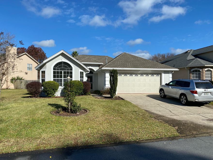 Welcome to this fabulous 1 story, 3 bedroom / 2 bath home with gas fireplace, that is perfect for a couple, small family, or retirees! Fridge in gar stays w hm!  Except for the kitchen, laundry, & baths having tile flooring, all the rest of the flooring is new! The 2nd & 3rd bedrooms have hardwood floors, & living room, dining room, foyer, and breakfast nook have LVP plank flooring! The home has been completely painted, inside and out, including inside the closets! All light fixtures in the home have been replaced and run on LED lights and the home boasts a central vac!  The roof was replaced in March of '21, so lots of life left in it.  The HVAC had the coil replaced in Sep '21, and the motherboard was replaced in June of '24! Even the microwave was replaced in '23! ... (Pls click More) The dining area has crown molding, wainscotting, and is right off the kitchen!  You'll love the high ceilings, crown molding, and openness of the home with little to no hallways, which gives you more living space! The HOA is only $150 / year to cover maintaining the sign and common grounds! You're never far from the white sandy beaches of the Emerald Coast and right between Eglin AFB and Hurlburt Field!  Check the pics and call for your appointment, today! Snatch up this well maintained and lovely home before someone else does!  Cheers!